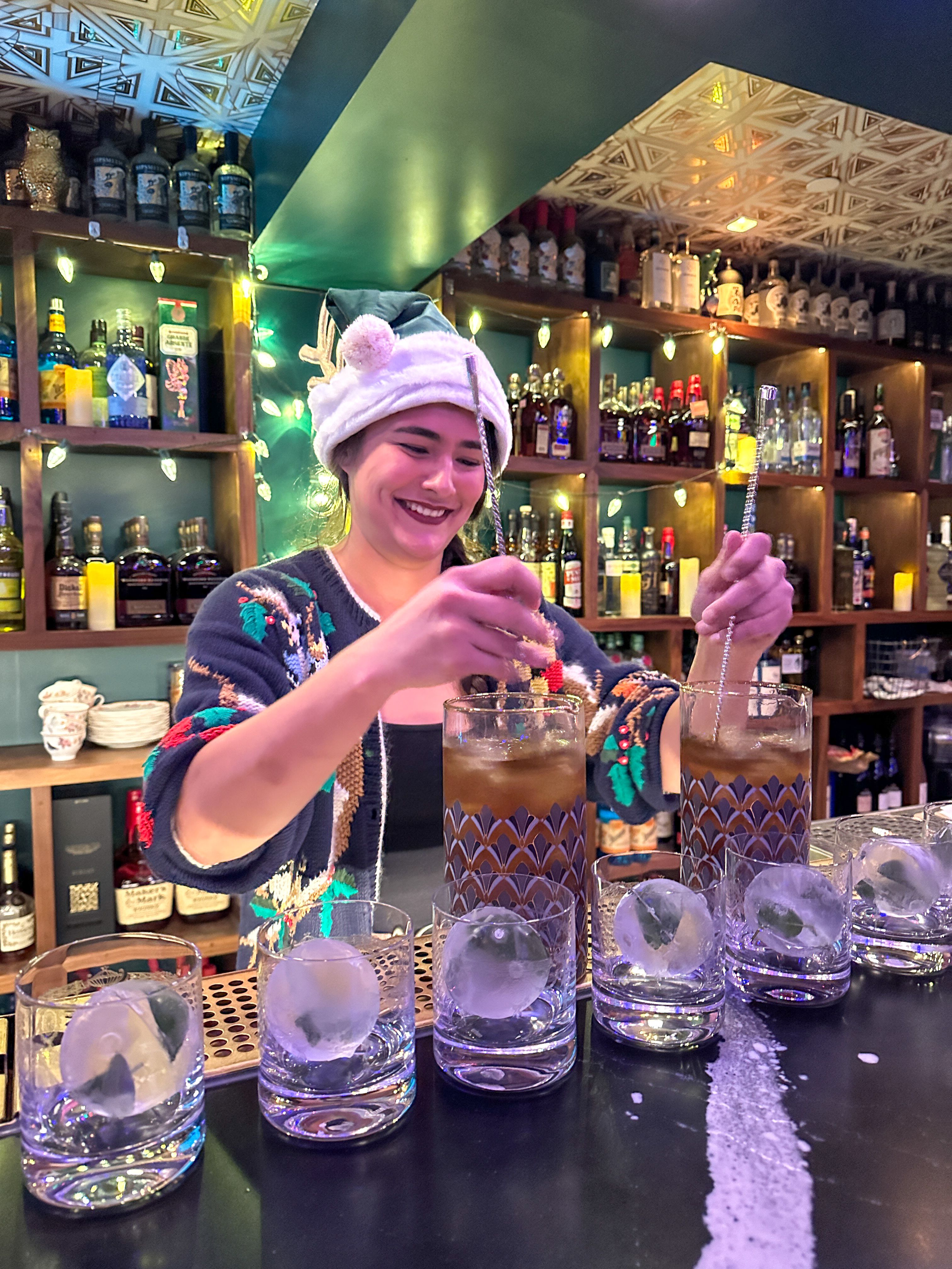 person mixing cocktails