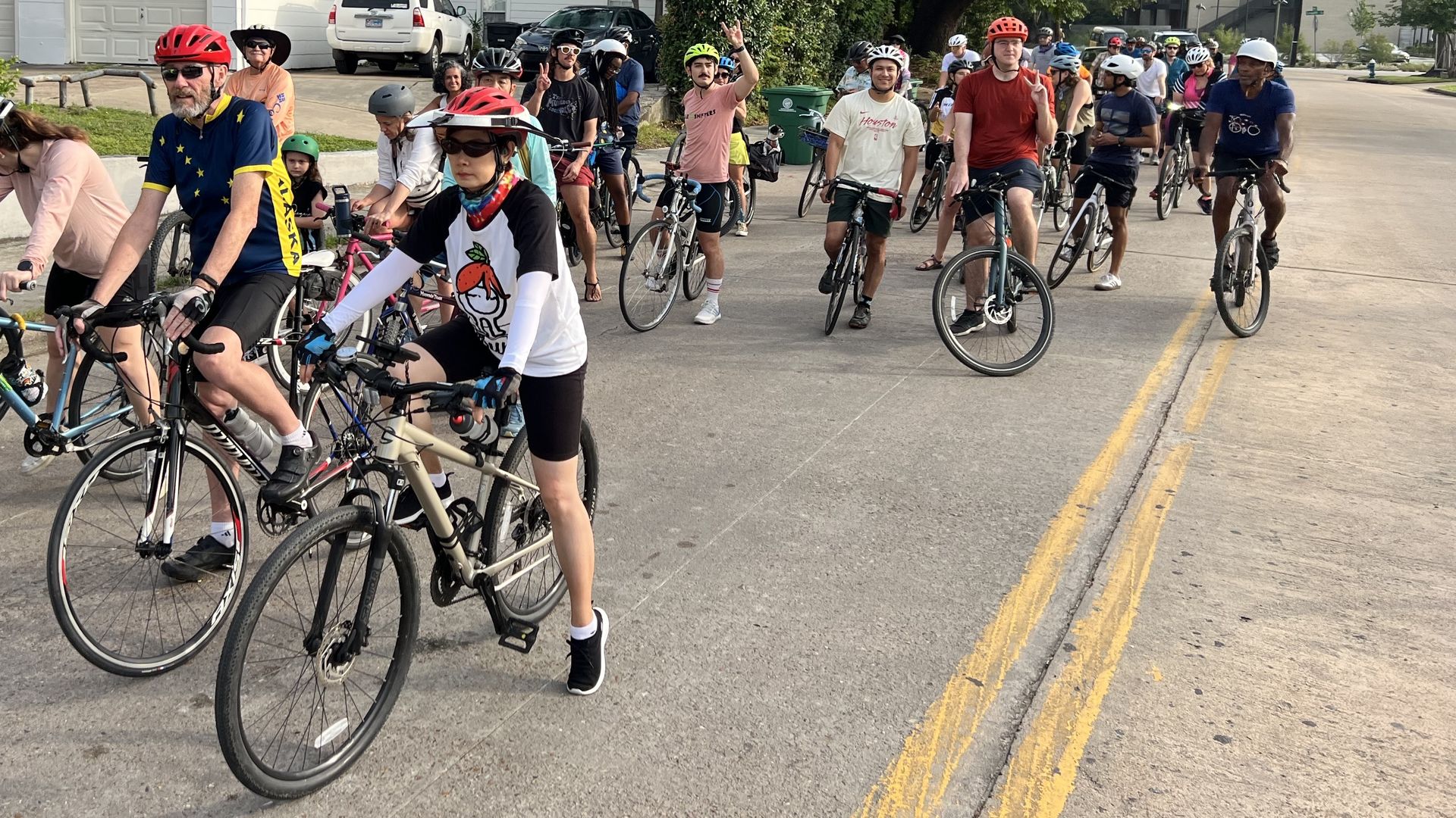 A group of cyclists ride through Montrose