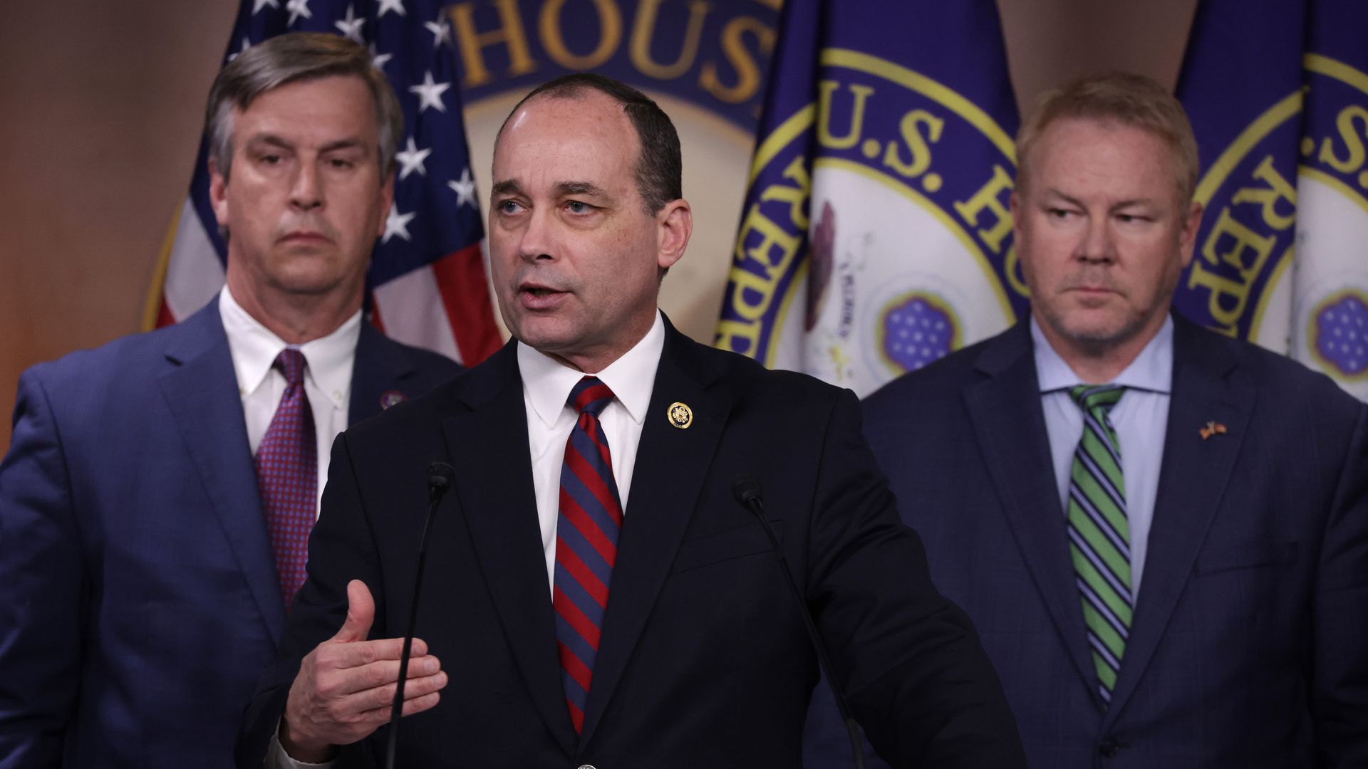 Caucus Chairman Rep. Bob Good (R-VA) speaks as Rep. Warren Davidson (R-OH) (R) and Rep. Barry Moore (R-AL) (L) listen during a news conference at the U.S. Capitol on February 13, 2024 in Washington, DC. The House Freedom Caucus held a news conference on the reauthorization of the Foreign Intelligen