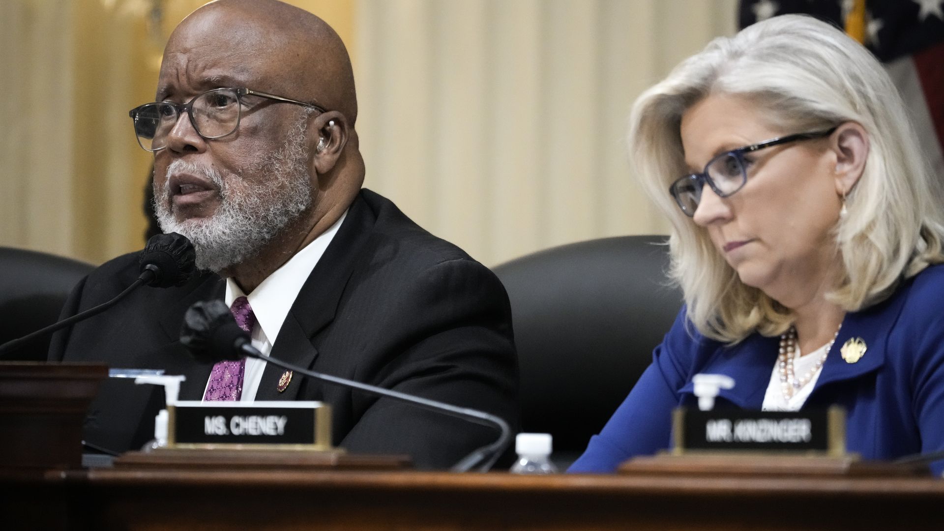 Reps. Bennie Thompson, wearing a gray suit, white shirt and red tie, and Liz Cheney, wearing a blue suit, white shirt and pearl necklace, at a Jan. 6 committee hearing
