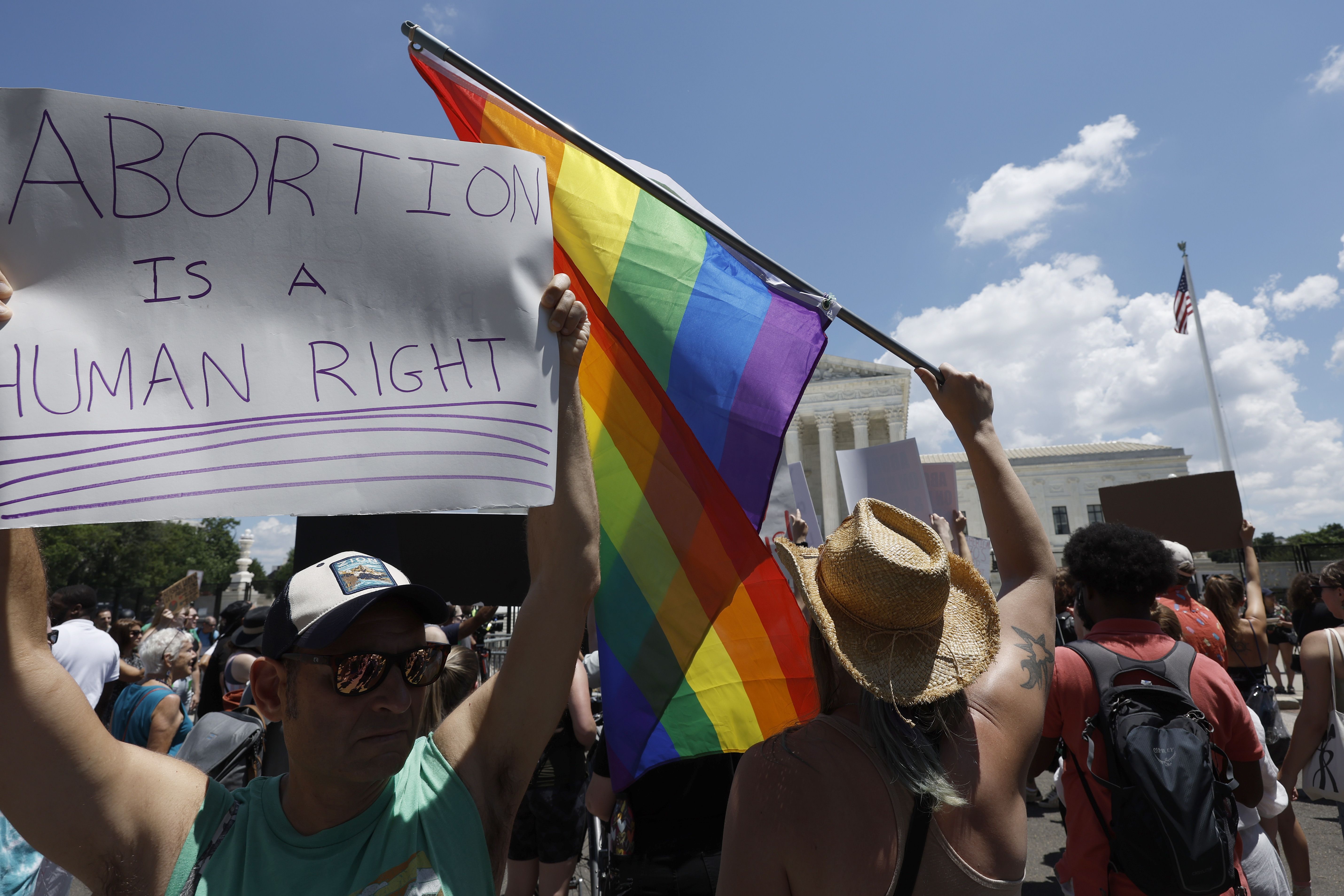 A protester holds a Pride Flag during a protest in the wake of the decision overturning Roe v. Wade outside the U.S. Supreme Court on June 25, 2022 in Washington, DC. 