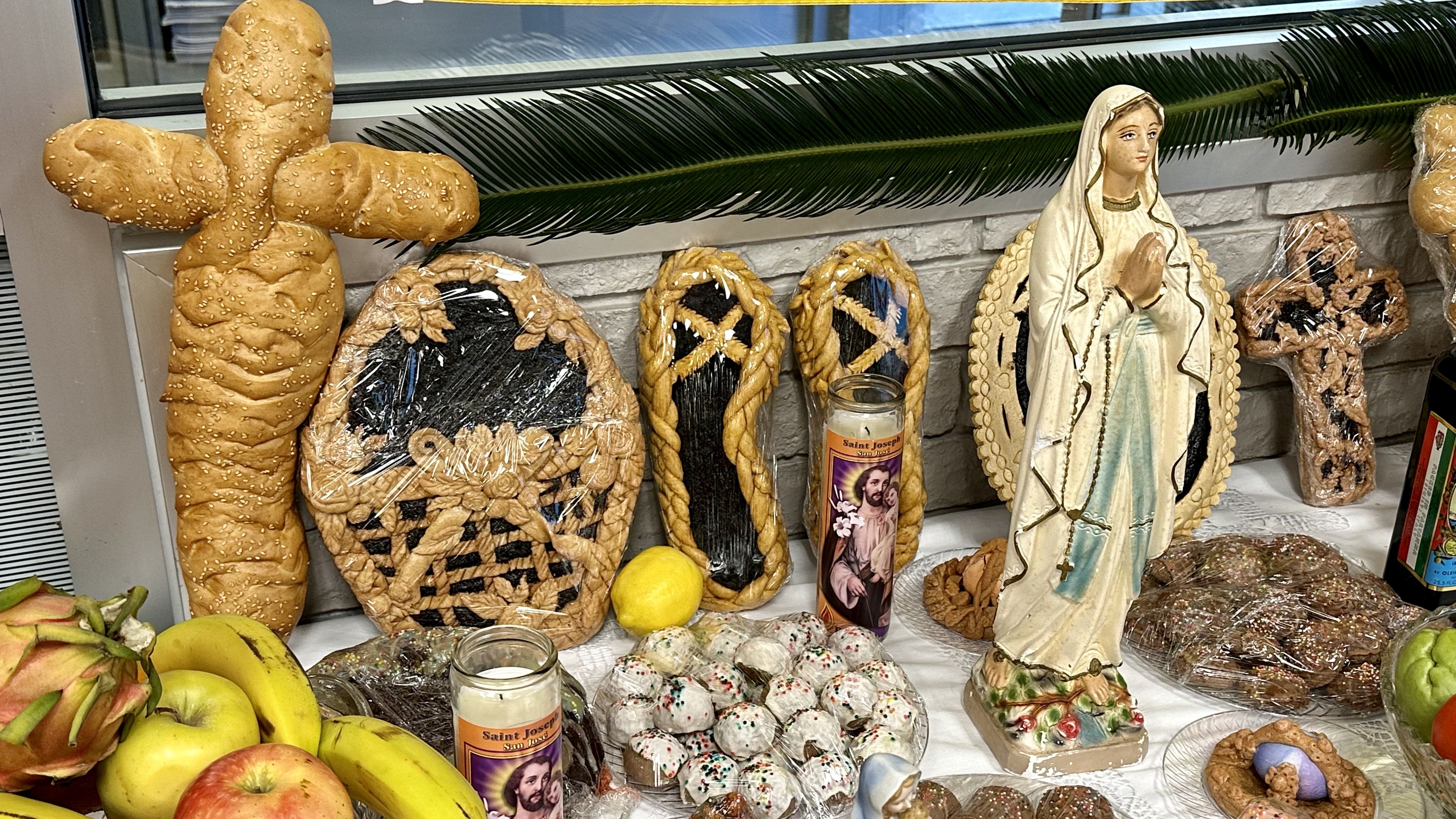 Photo shows baked goods shaped like crosses and sandals.