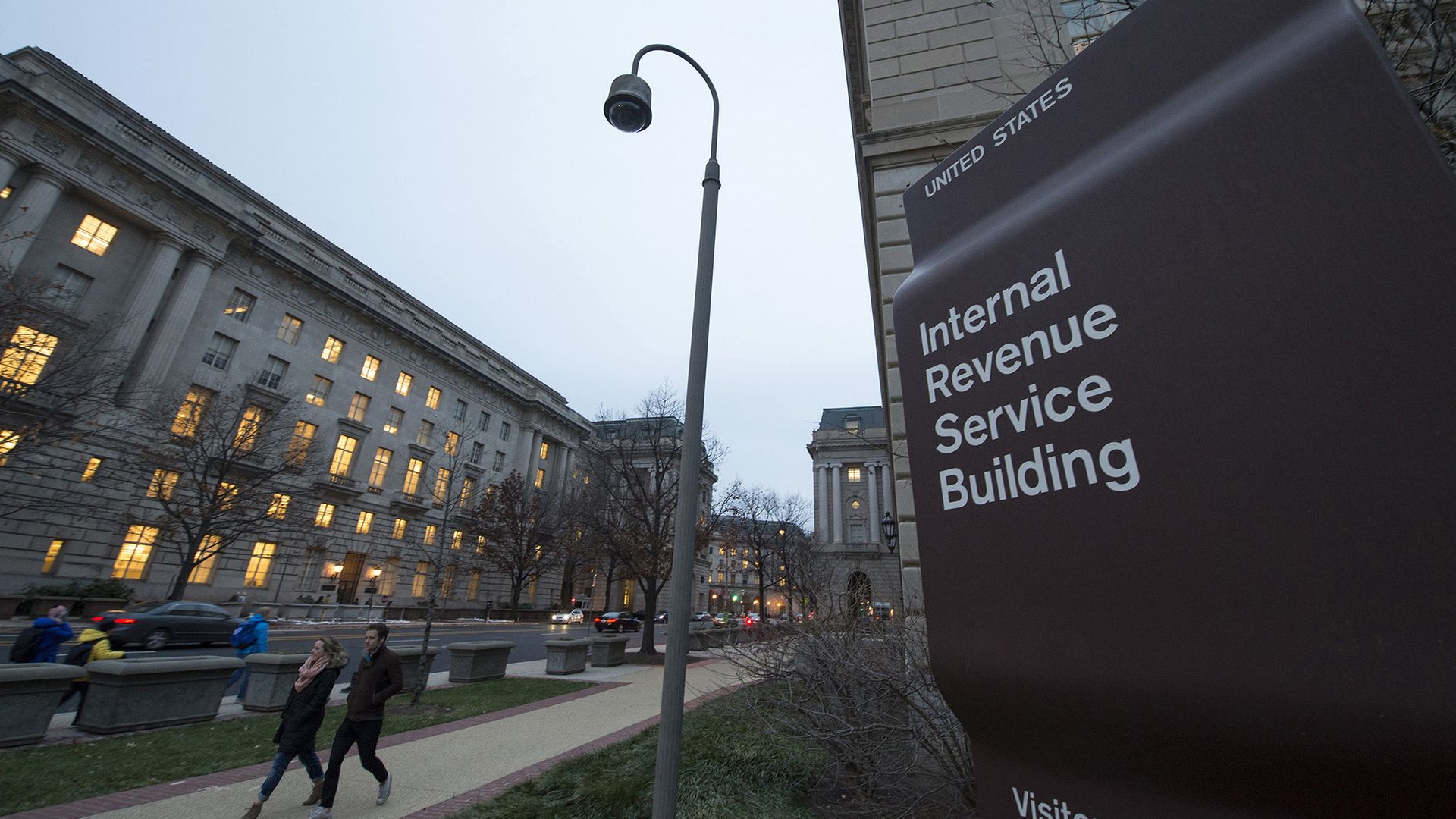 Workers enter the IRS building on Dec. 11, 2014, in Washington, D.C.