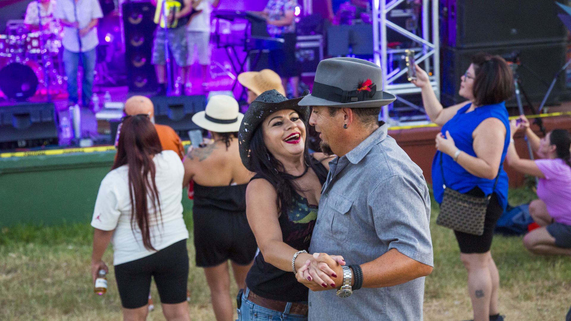 A couple dancing at a concert in Austin.