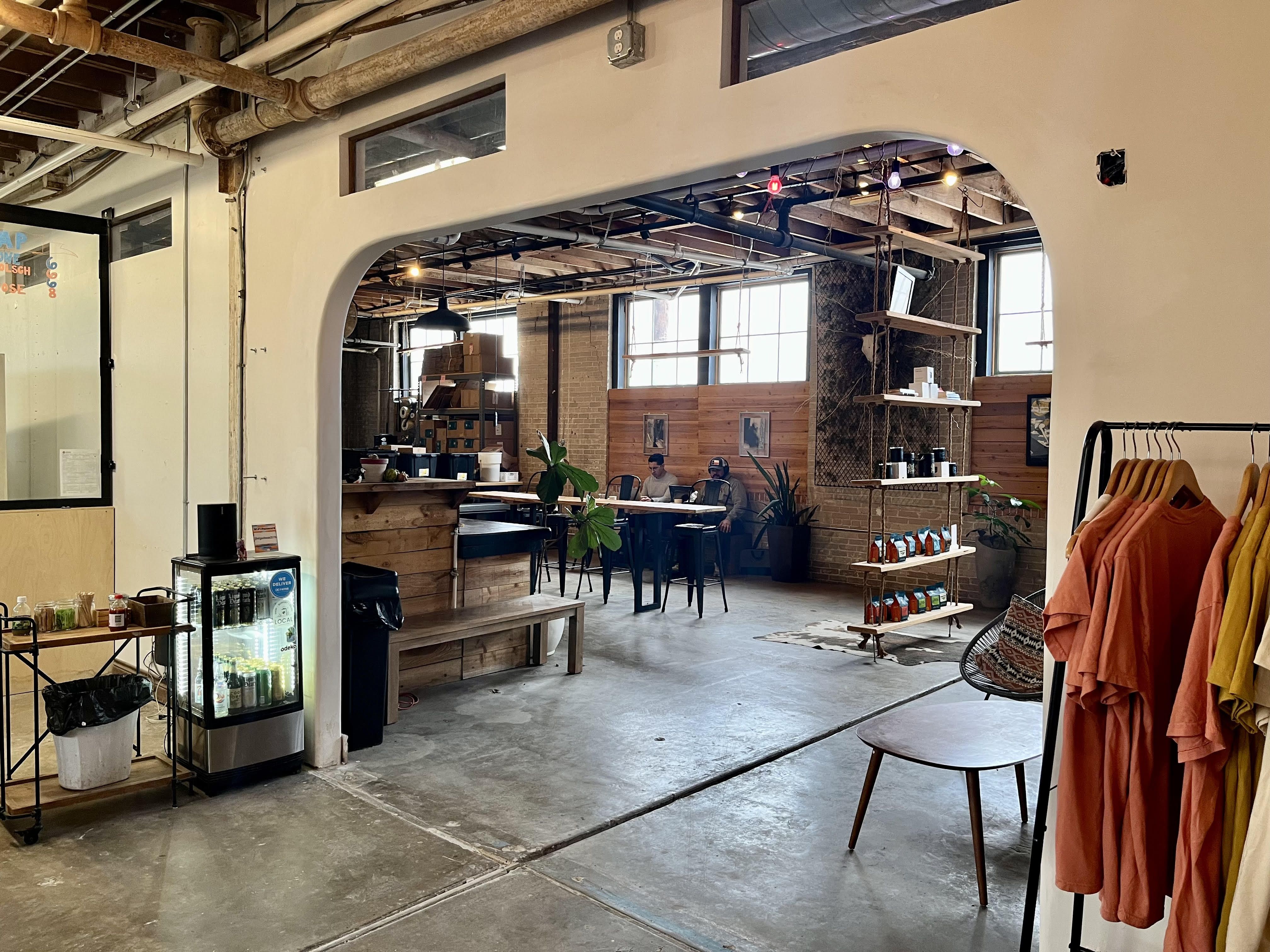 An open wall shows the old Shotgun House.