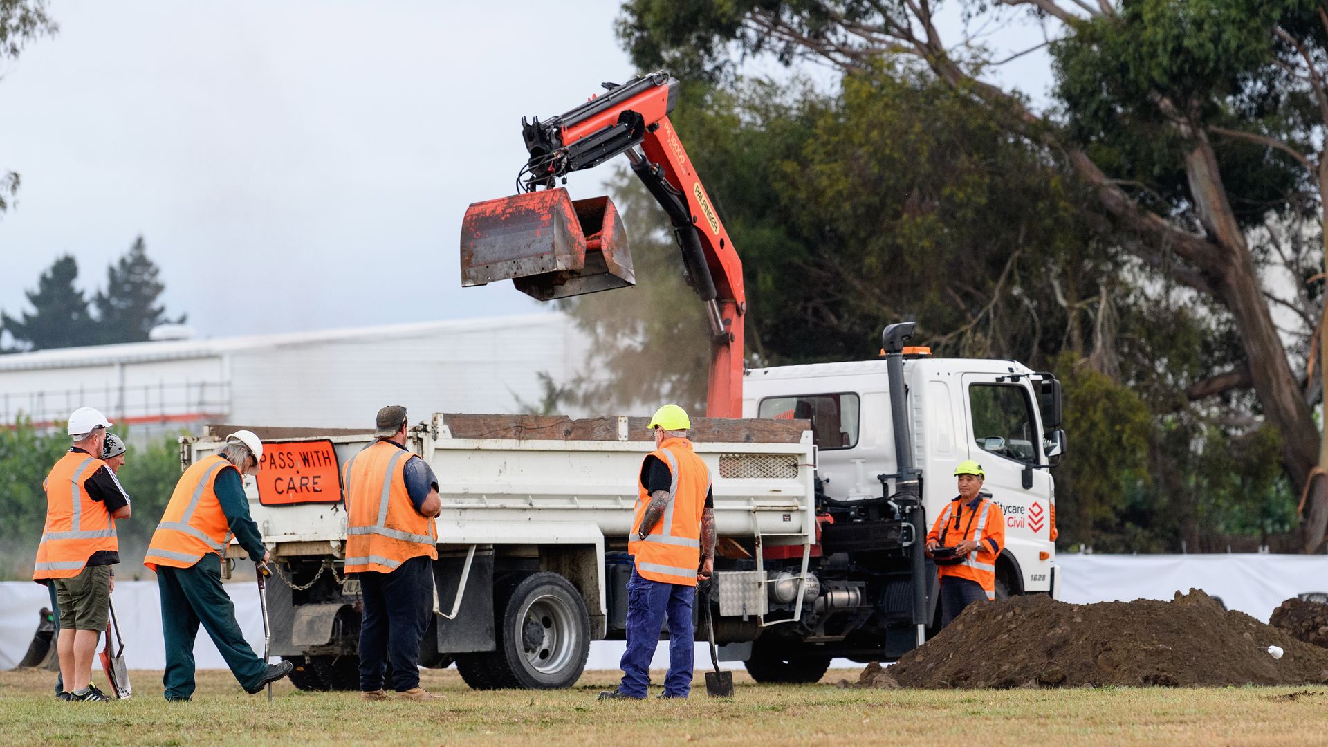 Workers begin digging graves for the victims of the New Zealand mosque attacks.