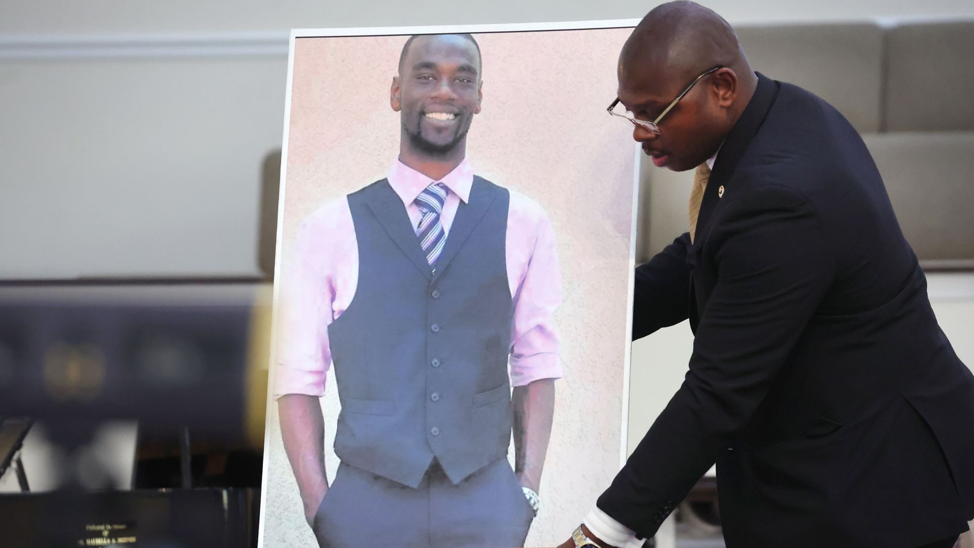 A person setting up a photo of Tyre Nichols in Memphis, Tennessee, in January 2023.