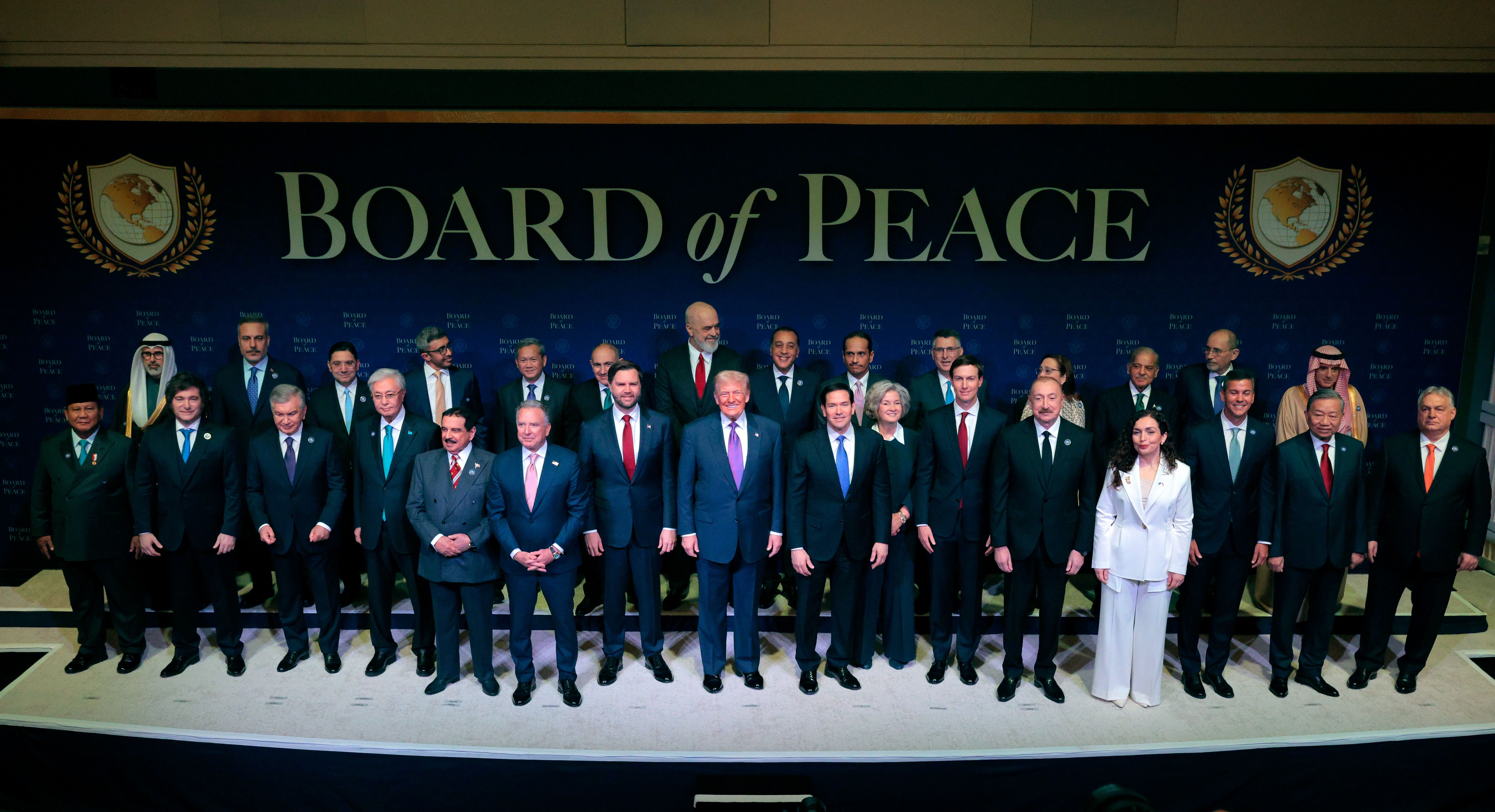 President Trump stands with Vice President JD Vance, Secretary of State Marco Rubio, Susie Wiles and Jared Kushner during a group photo at a Board of Peace meeting in Washington, D.C.