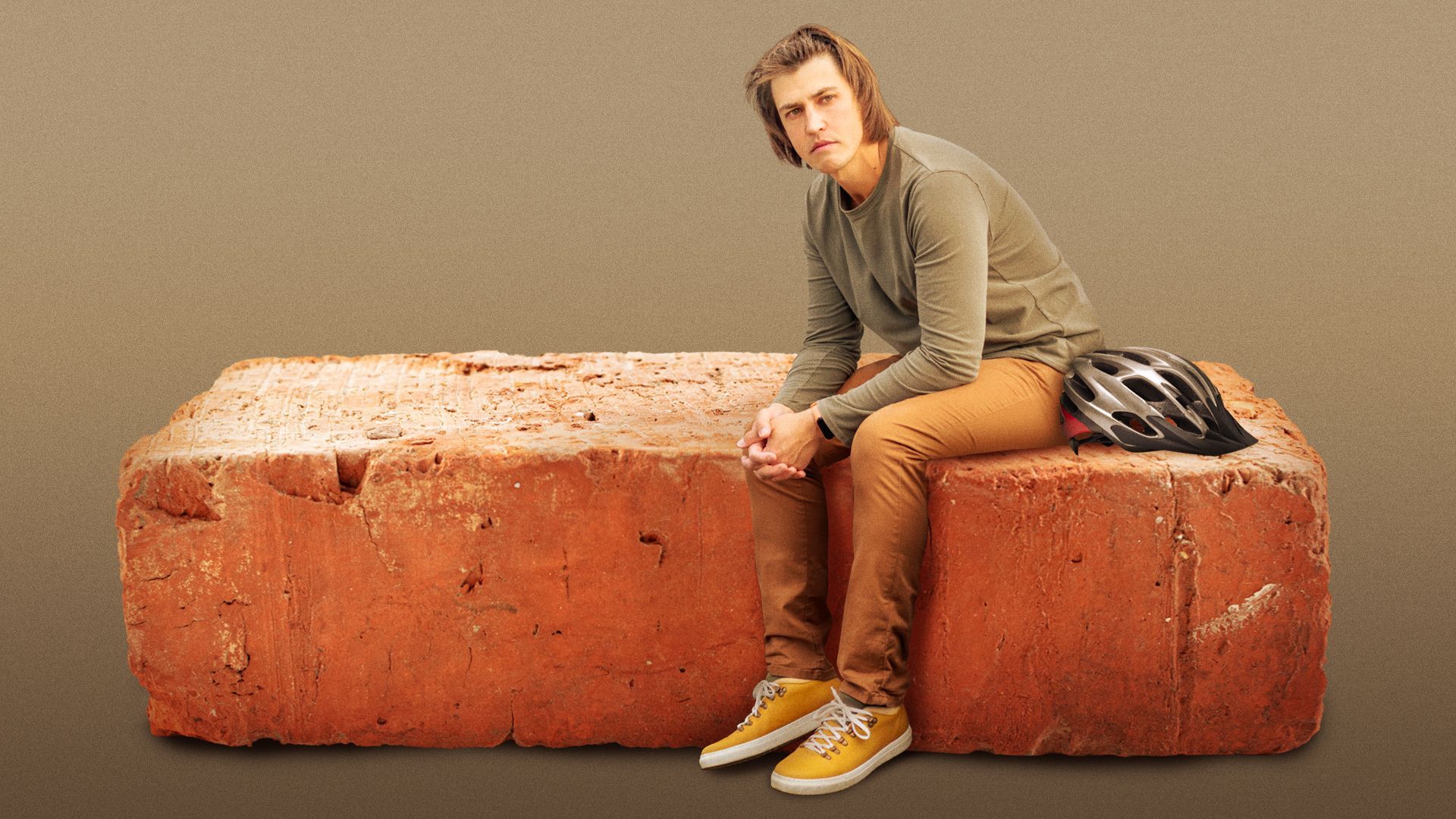 Illustration of a disappointed person sitting on a large brick with a bike helmet.