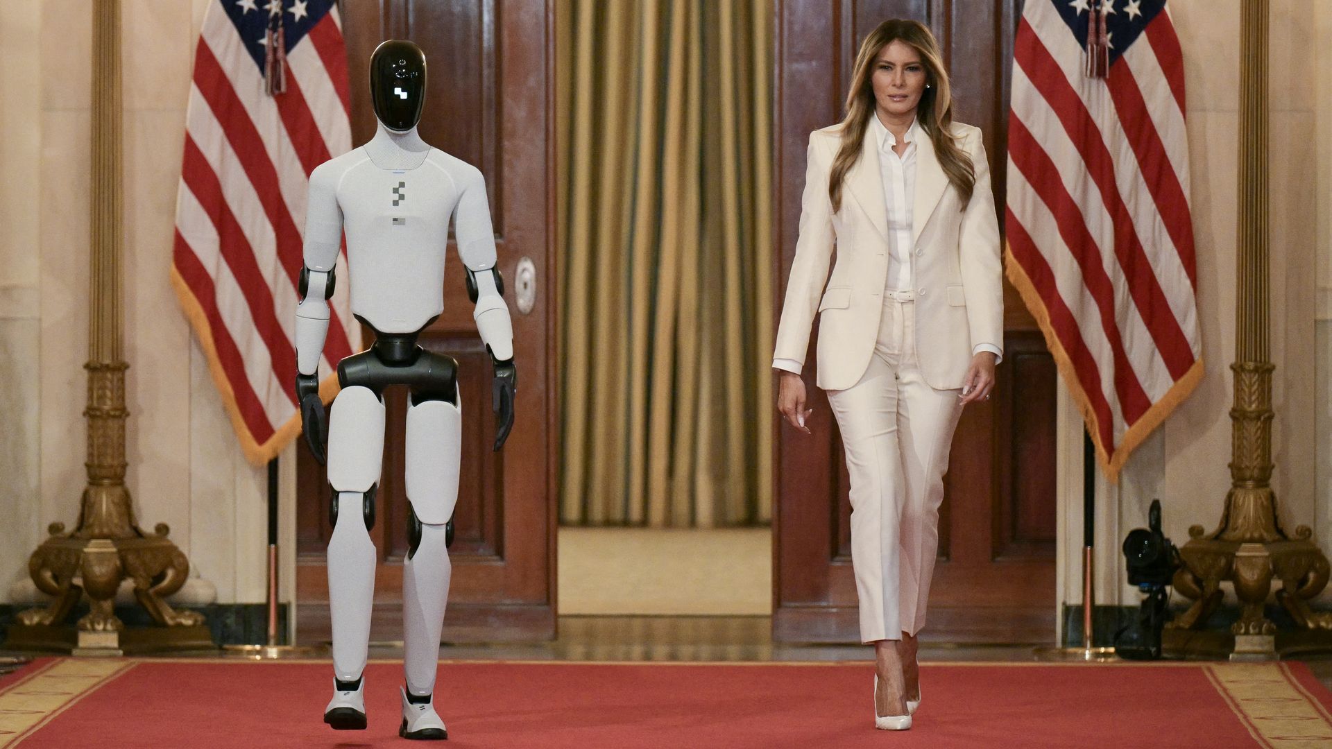 Melania Trump and a humanoid robot at the White House