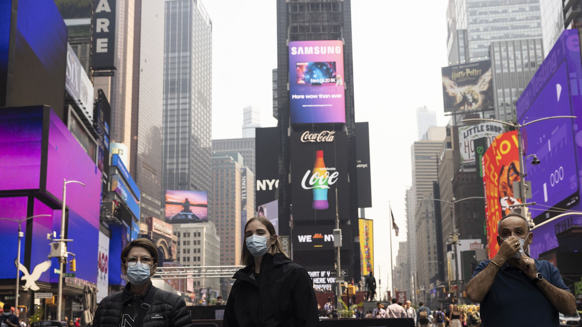 Photo of people wearing masks to protect themselves from wildfire smoke in New York City