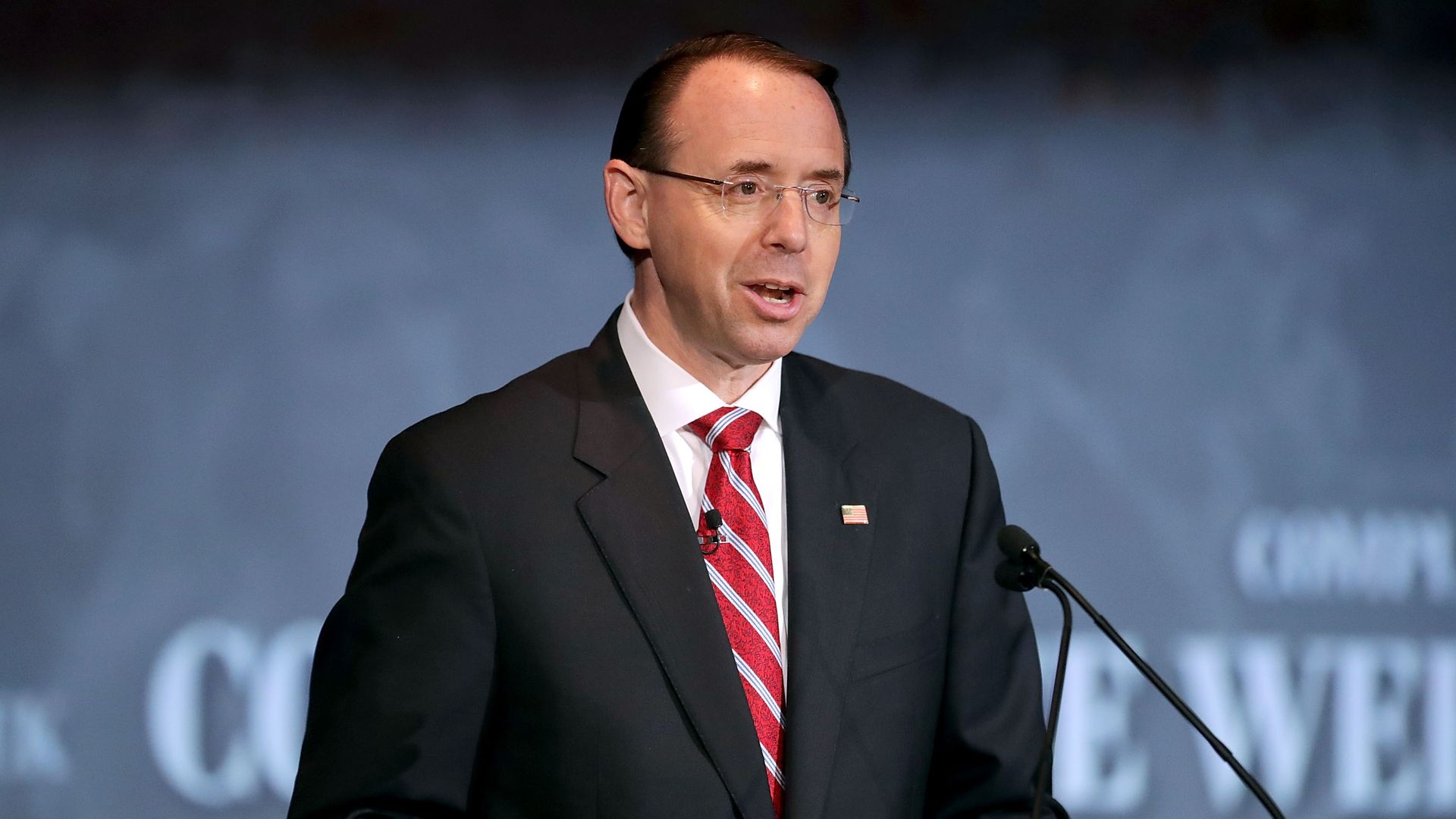 Rod Rosenstein speaks from behind a podium
