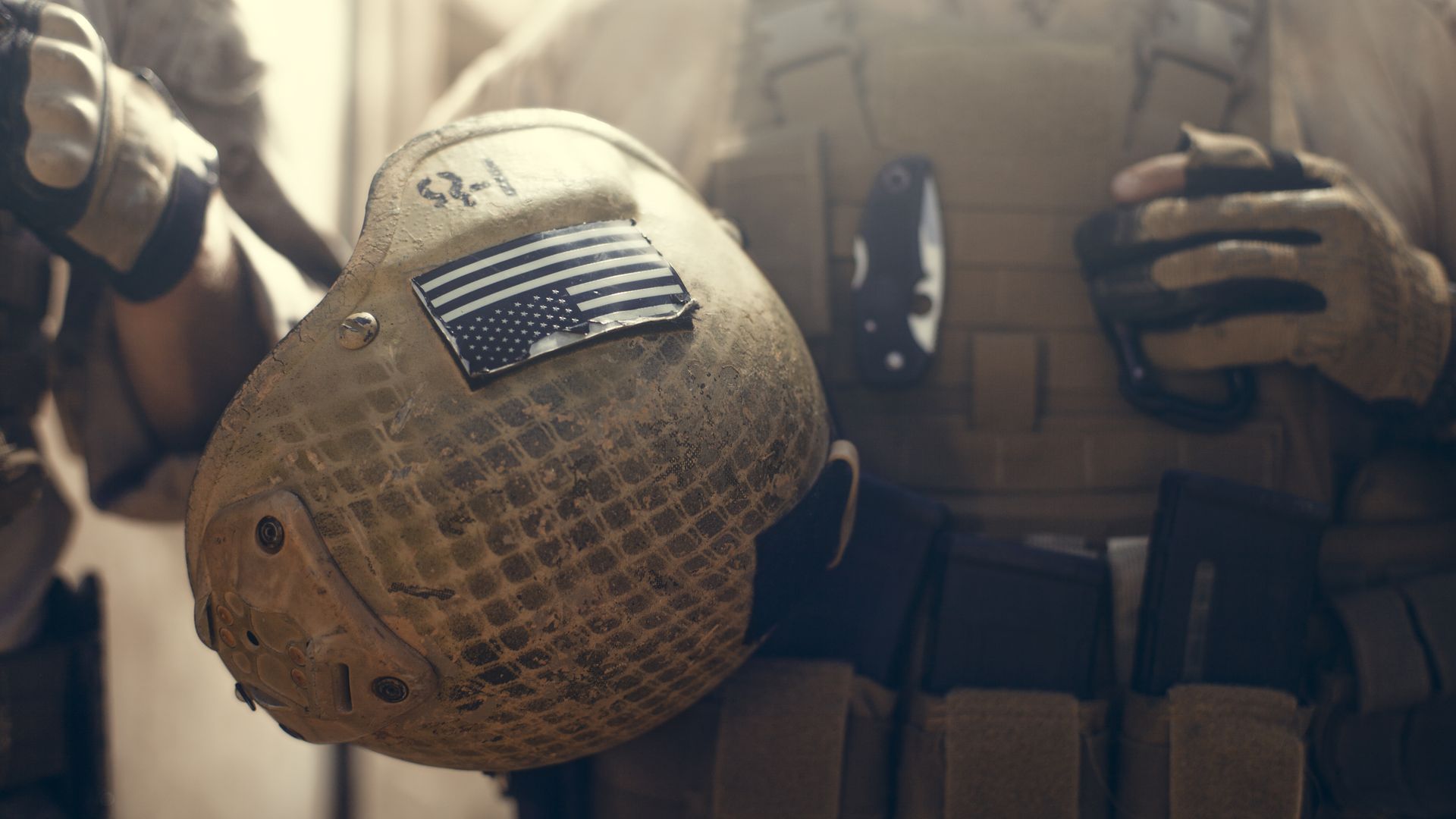 American soldier carrying their helmet
