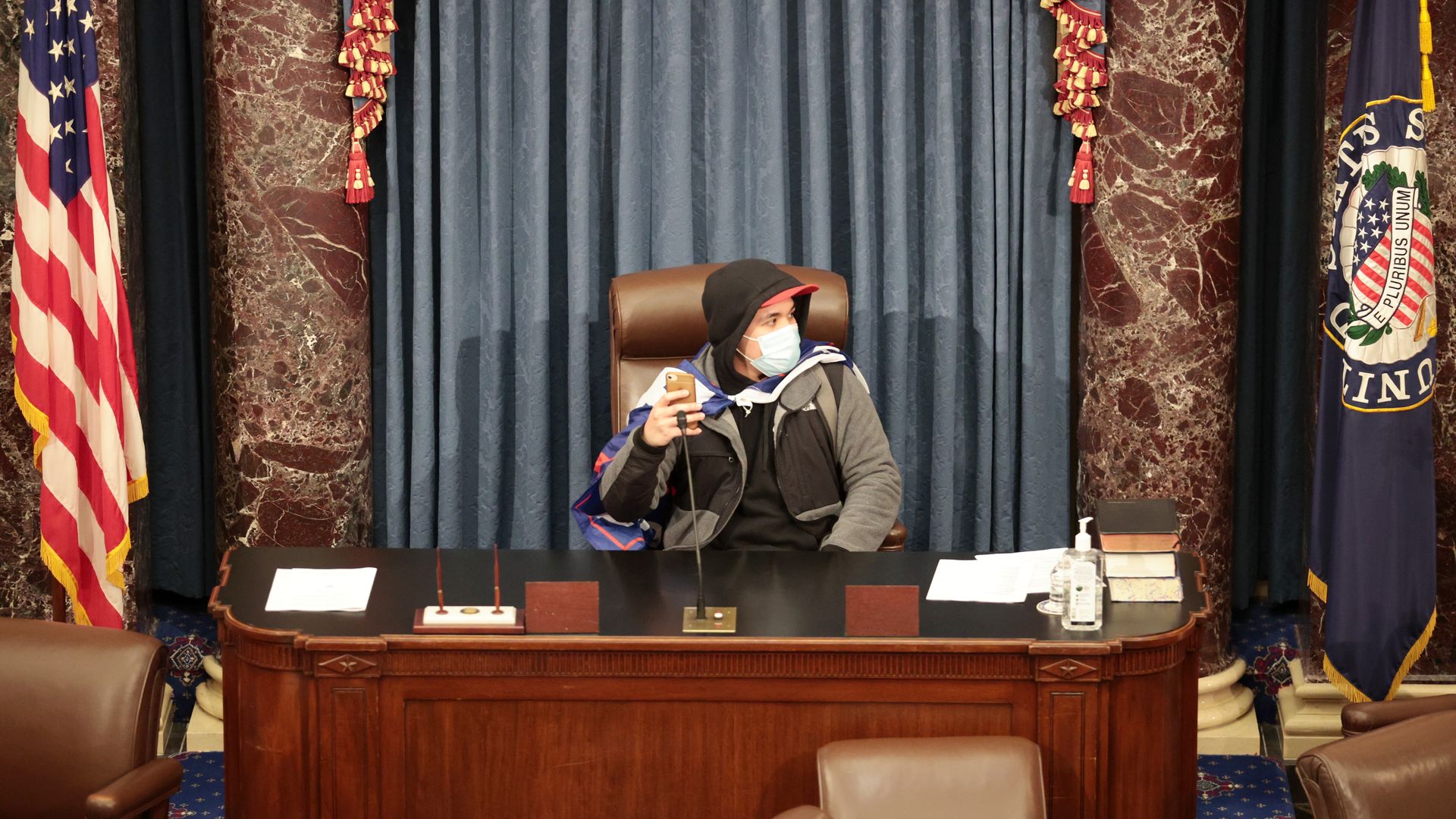 A man sits in the Senate chamber