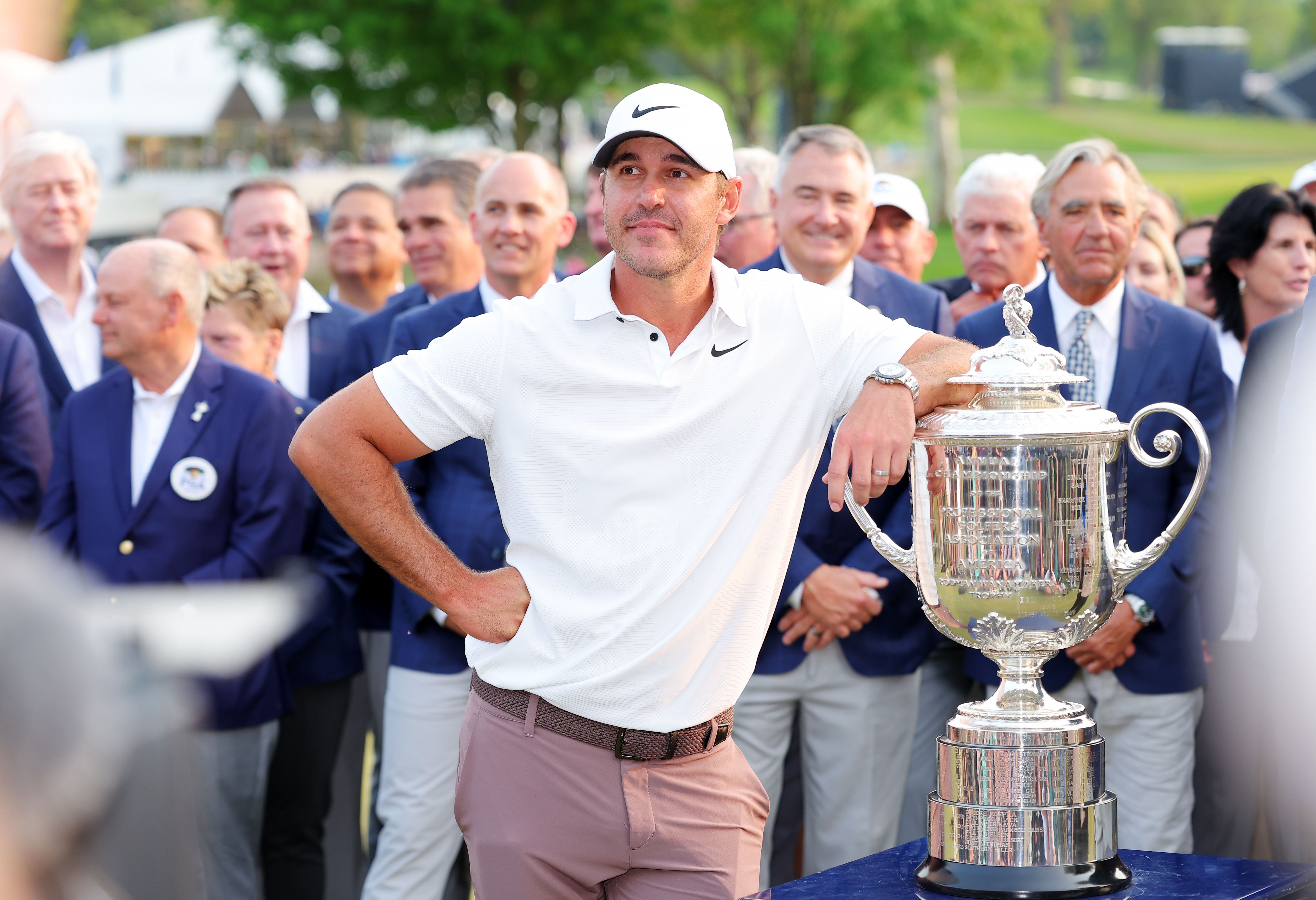 brooks koepka with his trophy