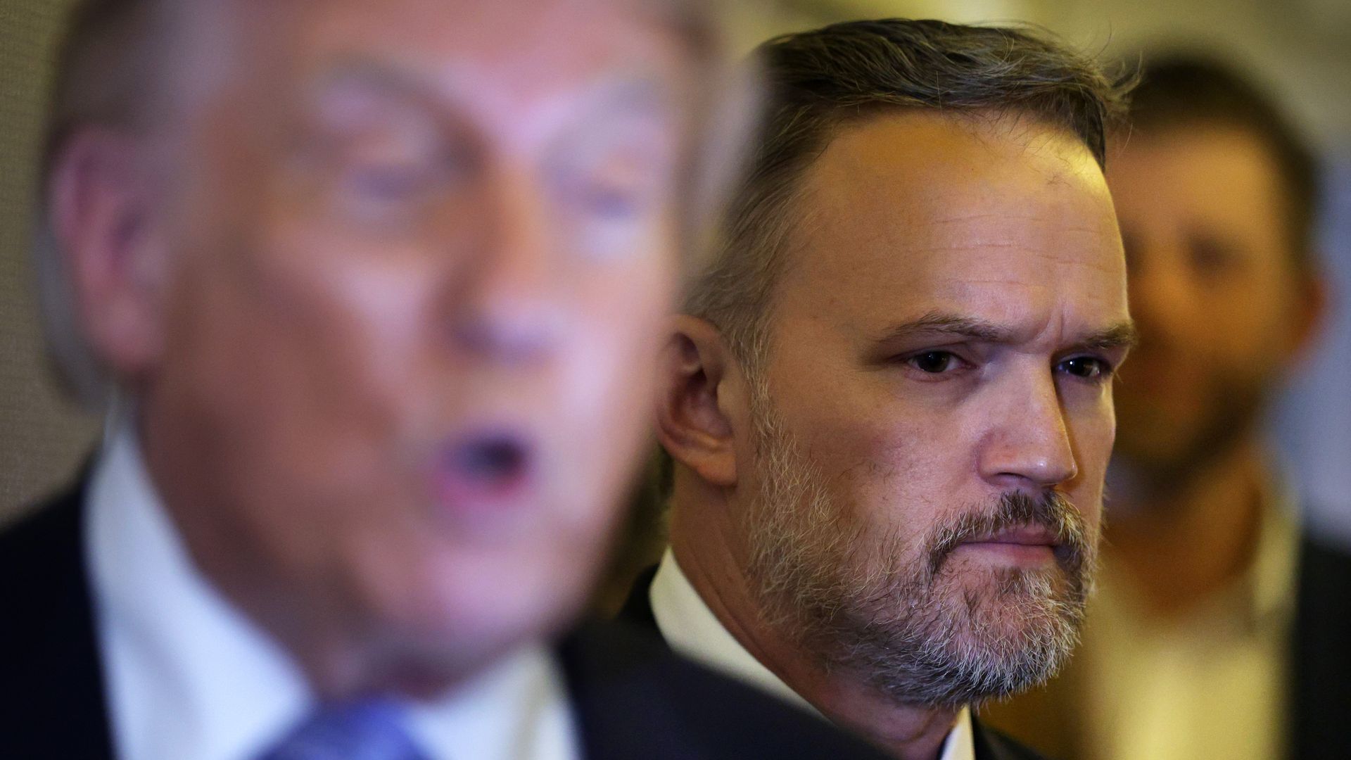 President Trump speaks to reporters as U.S. Trade Representative Jamieson Greer listens aboard Air Force One on May 15, 2026, returning from China. Photo: Alex Wong/Getty Images