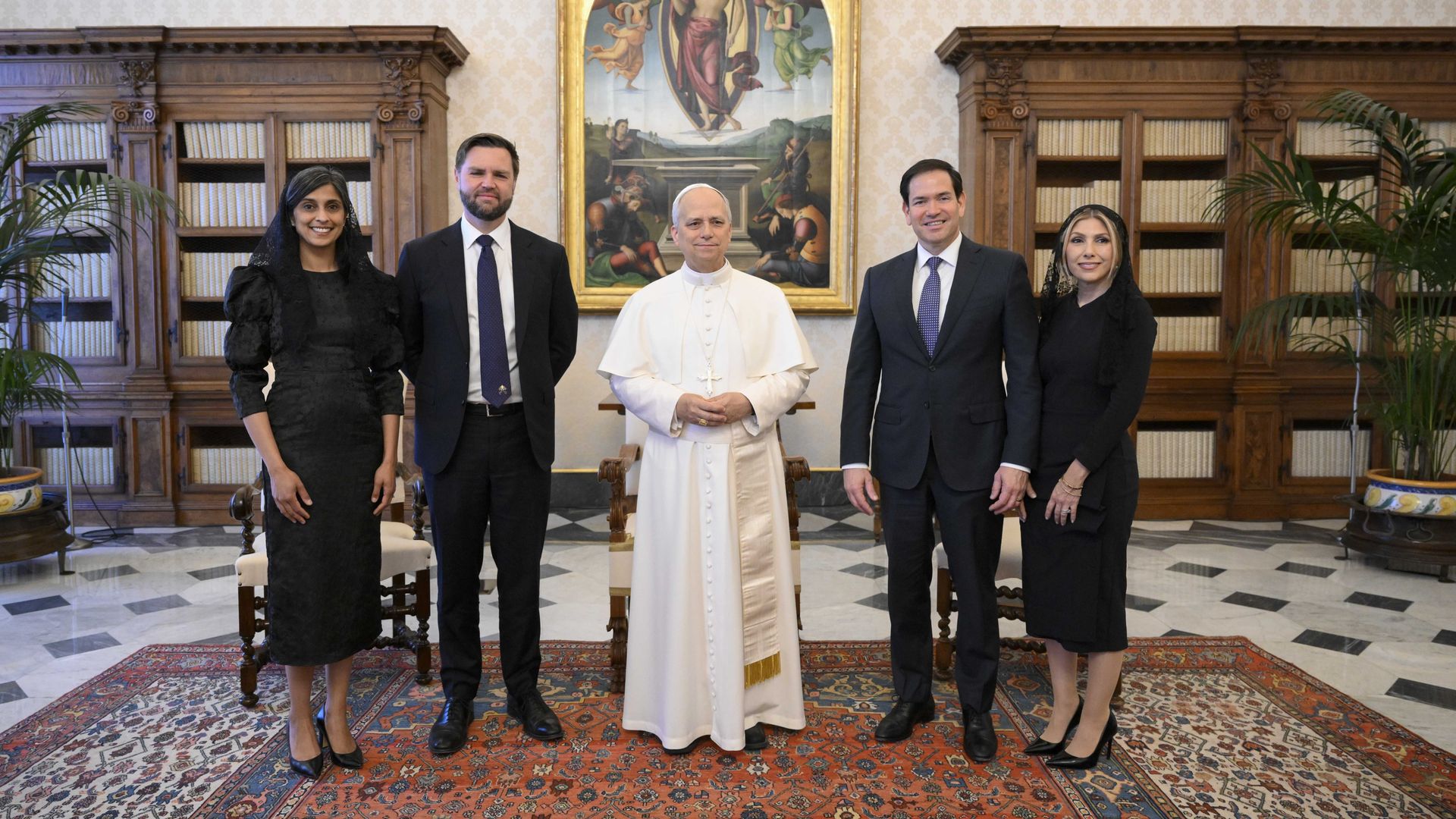 Pope with men in suits and women in black