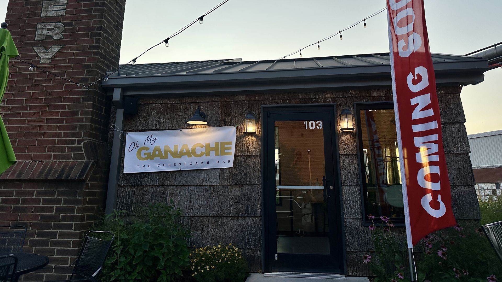 outside restaurant with sign that reads "coming soon"