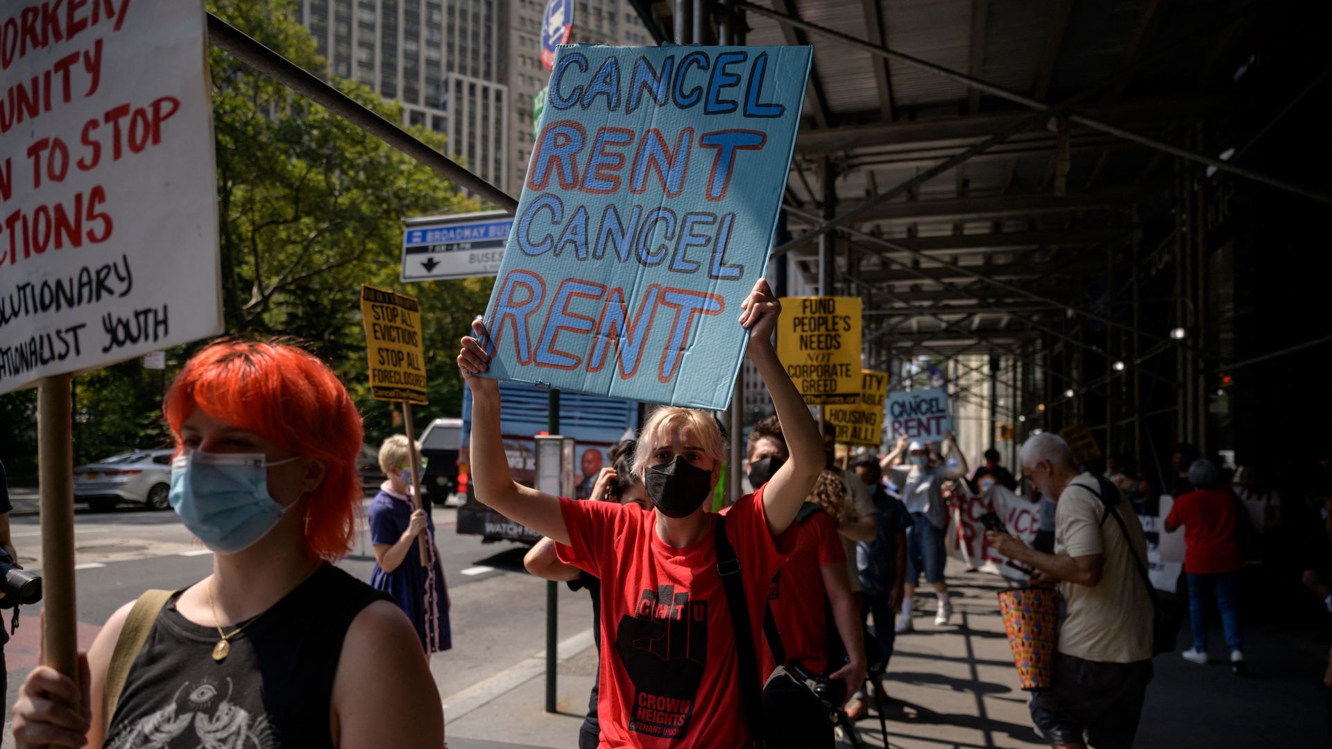 Demonstrators attend a rally calling for an extension of the state's eviction ban until 2022 