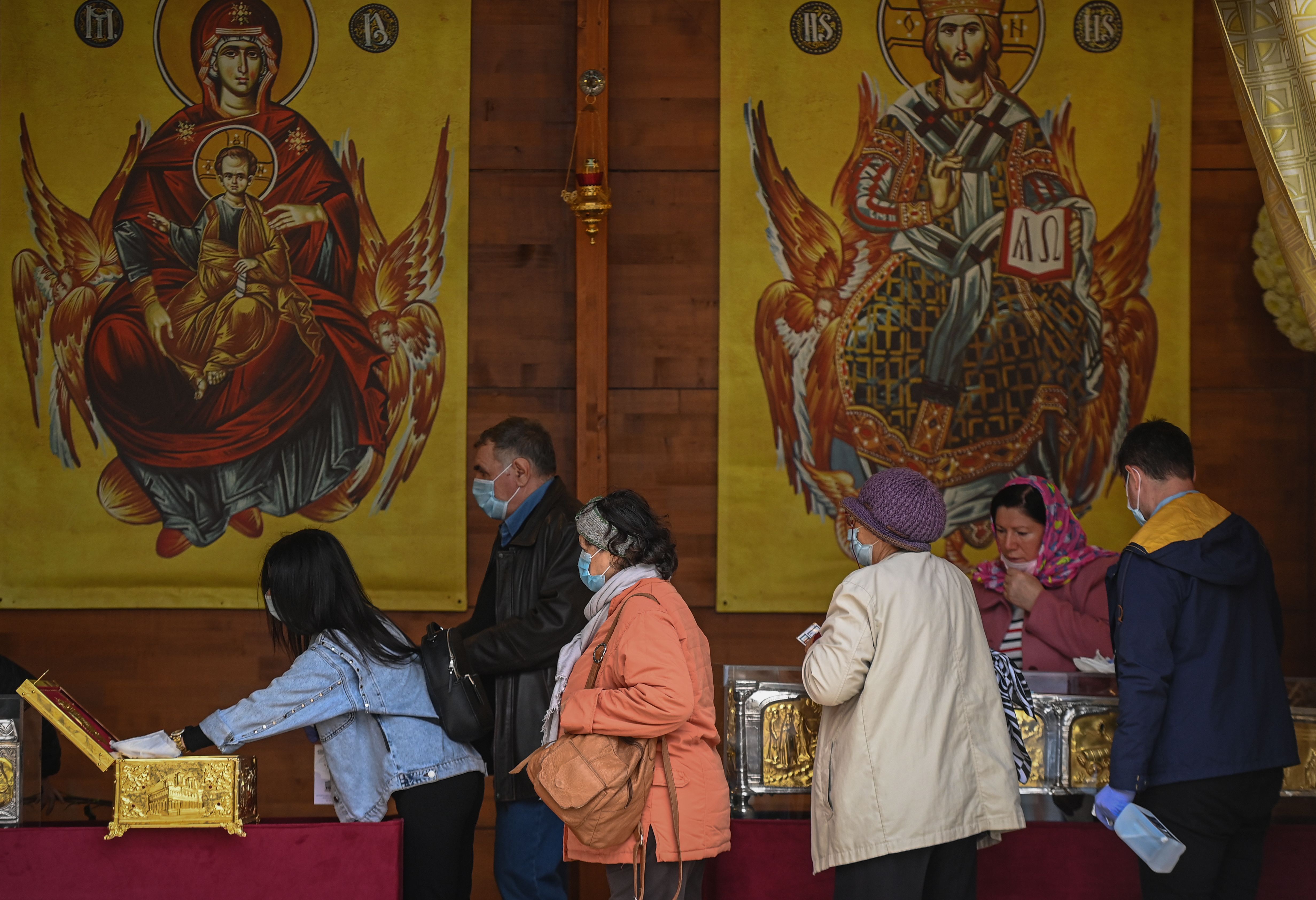 Romanian Christian-Orthodox believers worship the relics of Saint Dimitrie Basarabov at Patriarchal Cathedral in Bucharest October 25