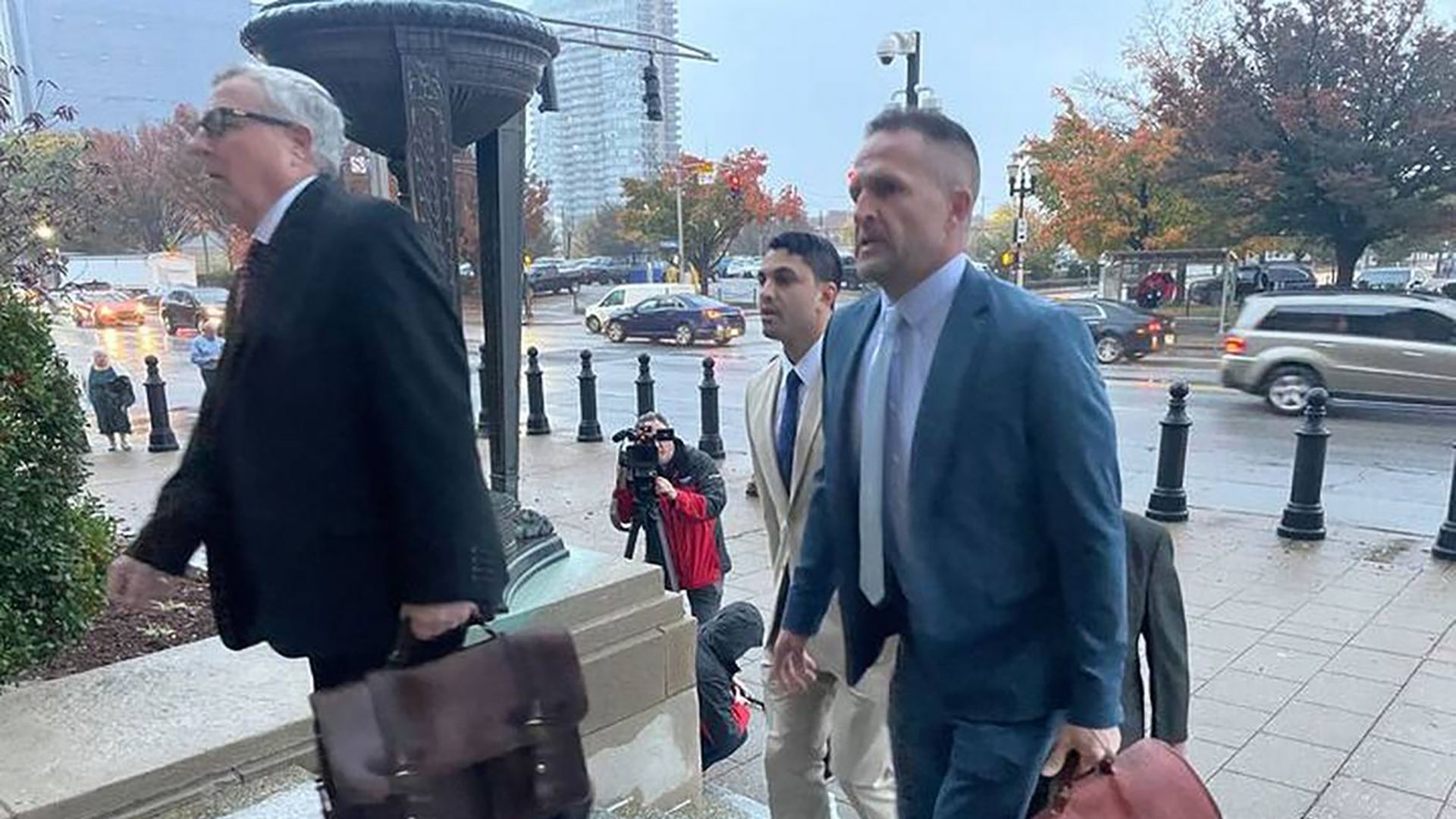 Brett Hankison, right, arrives in court alongside his attorneys in the federal trial which determined that he violated the civil rights of Breonna Taylor, her boyfriend, and neighbors. 