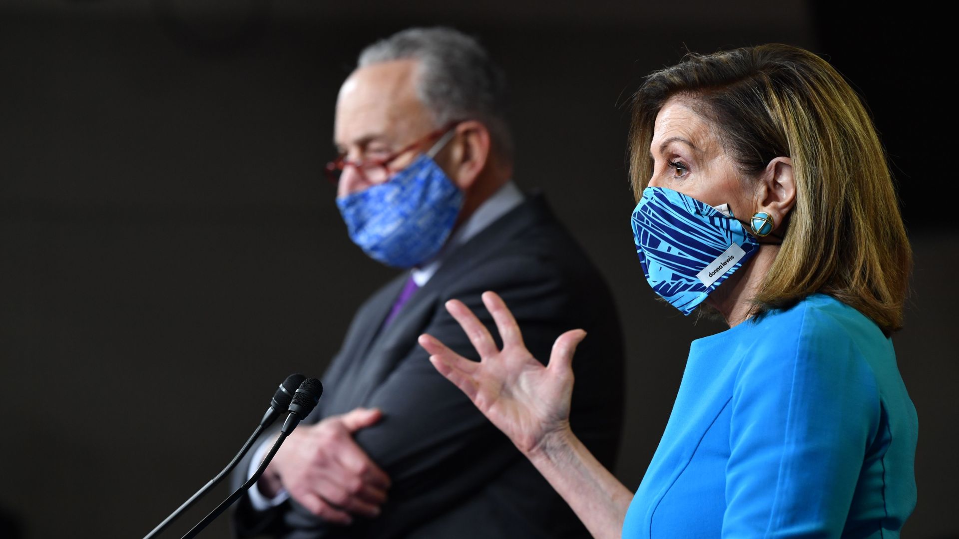 Pelosi and Schumer standing next to one another.