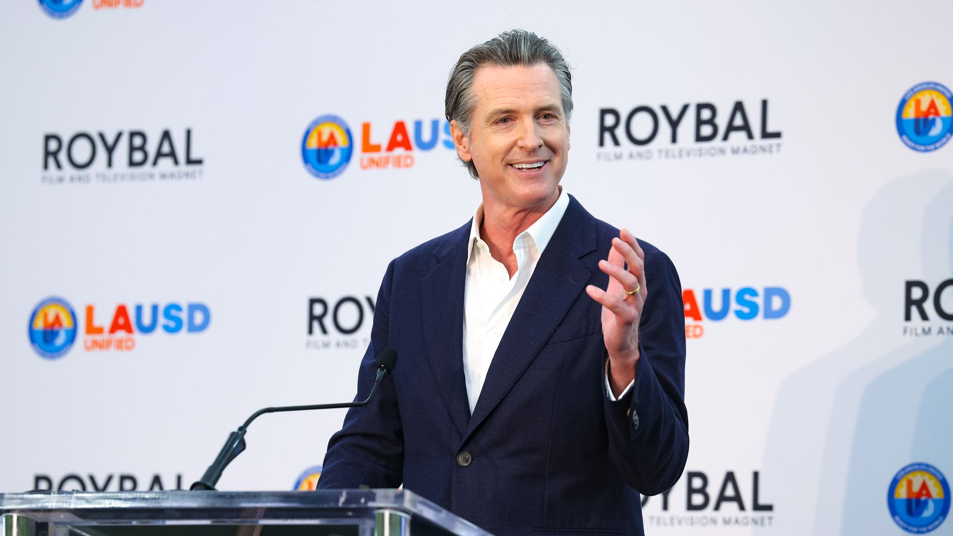 California Gov. Gavin Newsom speaks behind a podium.