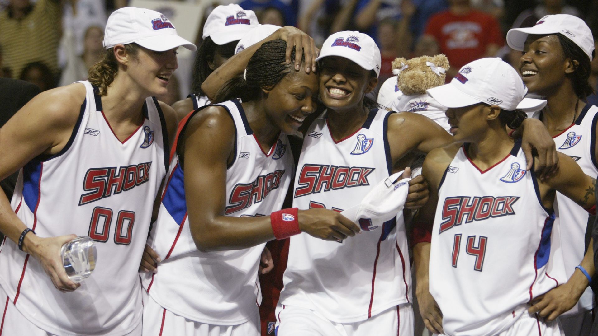 Detroit Shock players celebrate after defeating the Los Angeles Sparks in the 2003 WNBA Finals at the Palace of Auburn Hills.