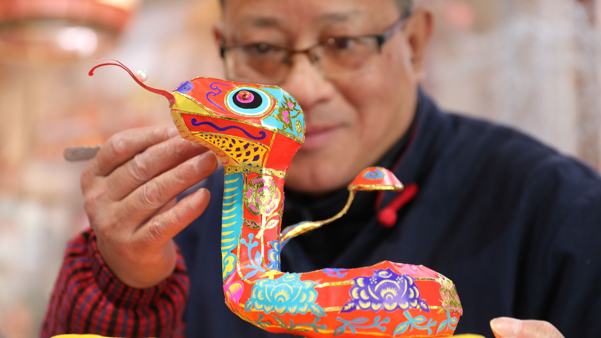 A wooden snake, representing the Lunar New Year 2025 (Year of Wood Snake). Photo: Axios.   