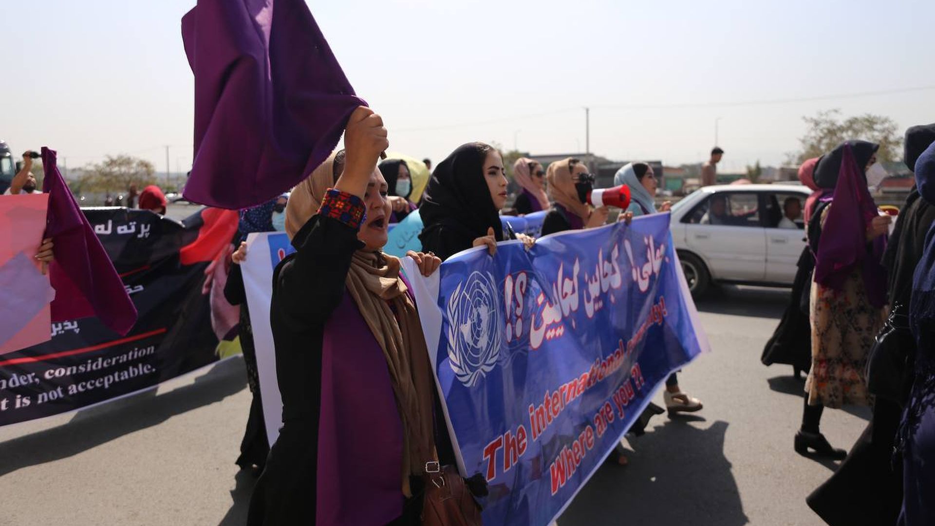 A group of women stage a rally calling on the Taliban to ensure women's rights.