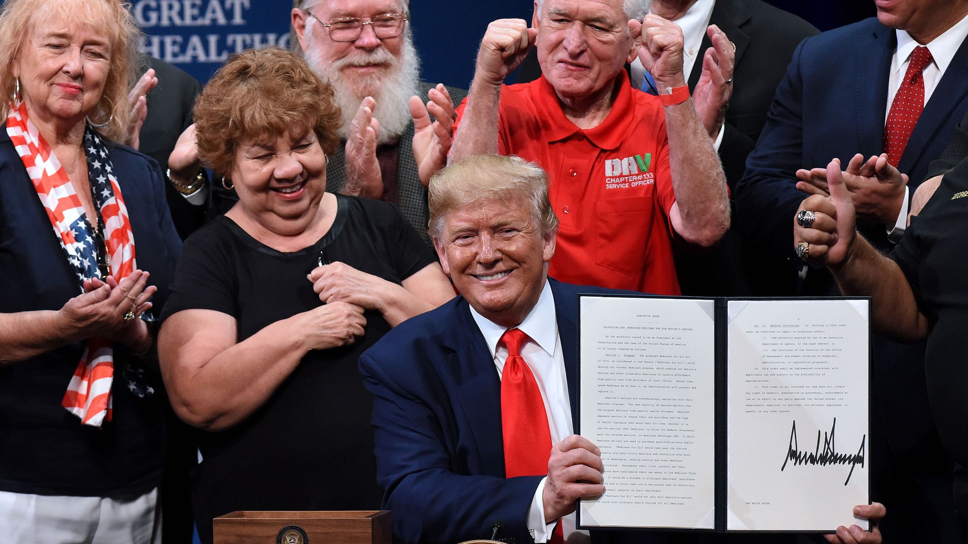 President Donald Trump signs an executive order to protect and improve Medicare