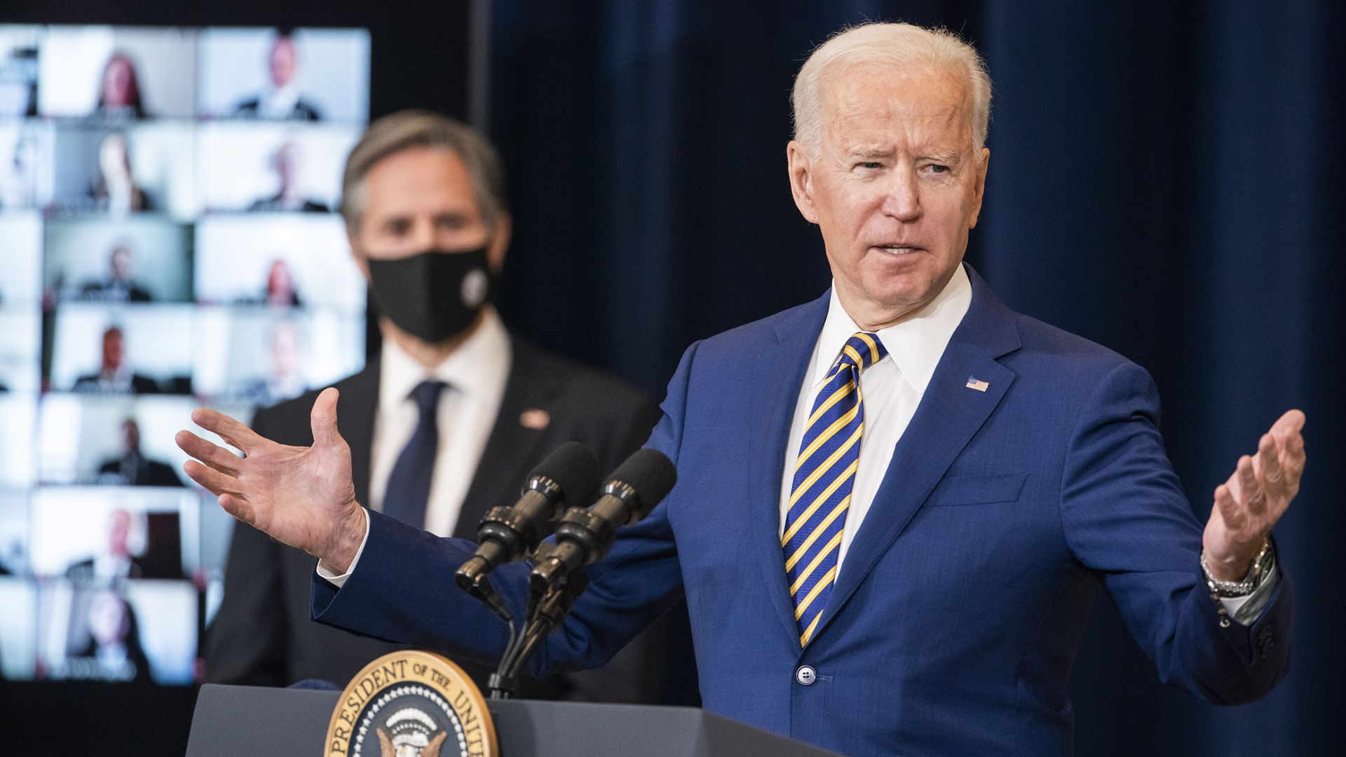 President Biden is seen speaking to Secretary of State Tony Blinken and incoming Foreign Service Officers during a visit to the State Department on Thursday.