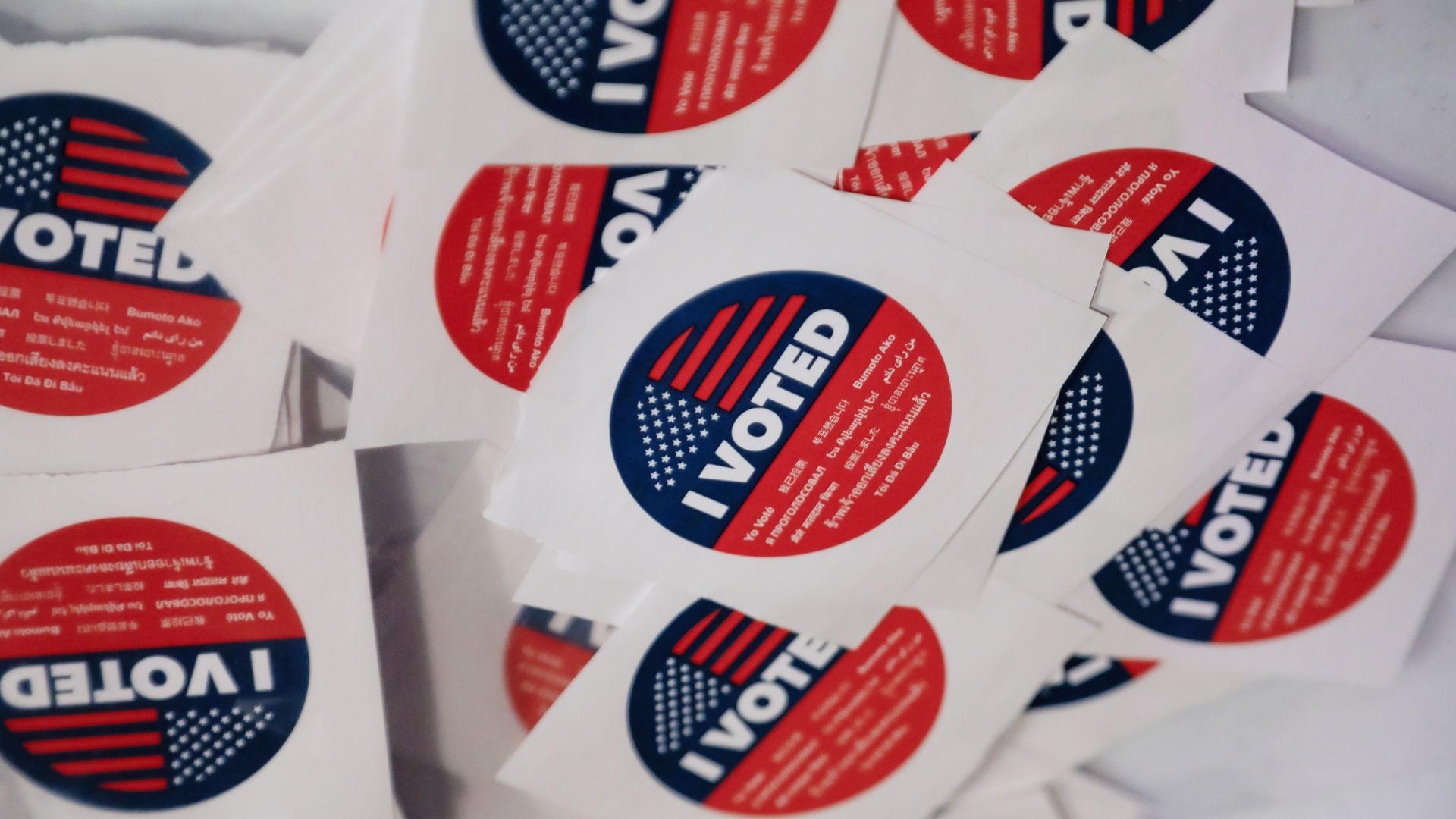Photo of a table filled with "I Voted" stickers.