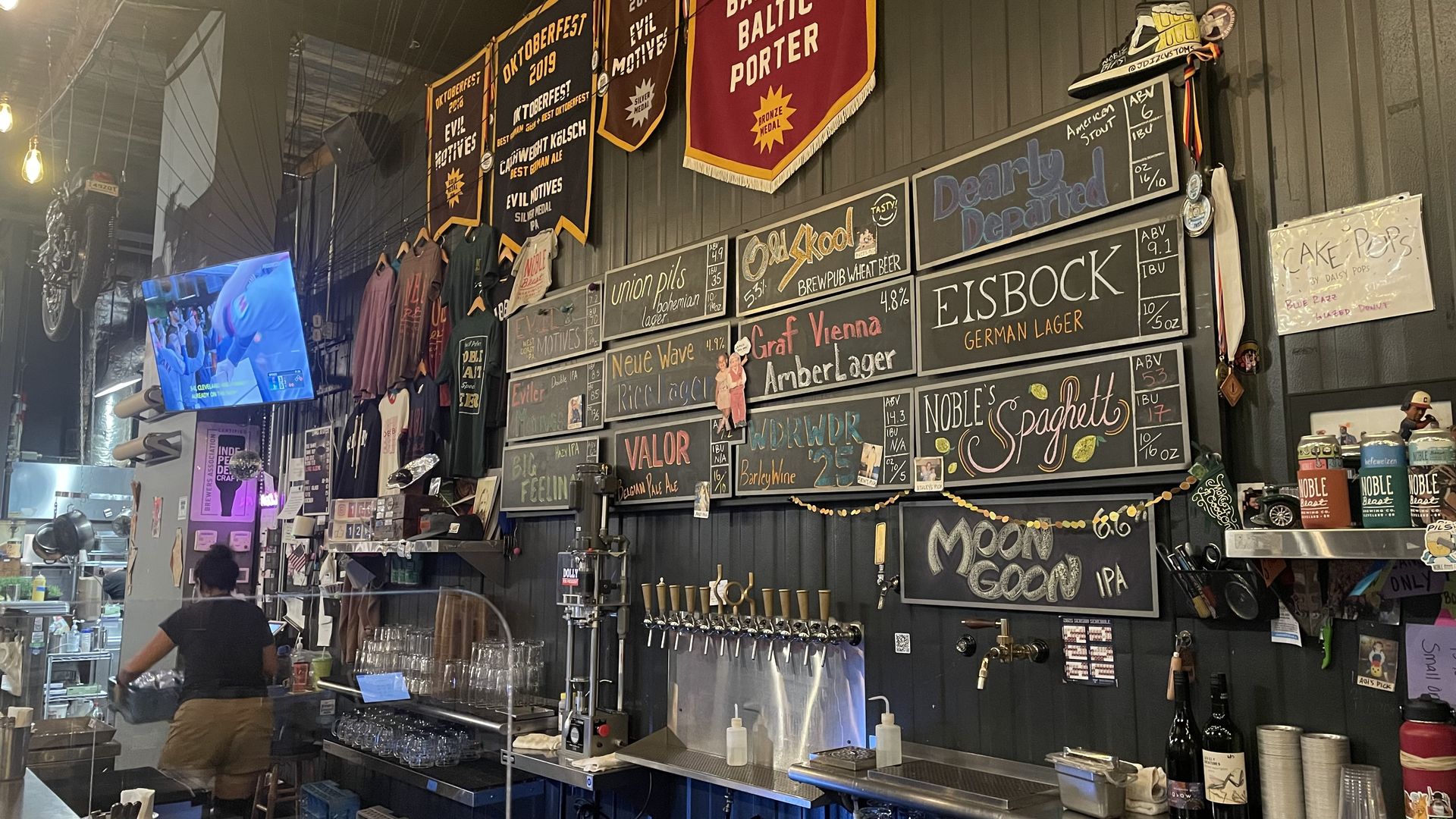 A bar with a menu on the wall