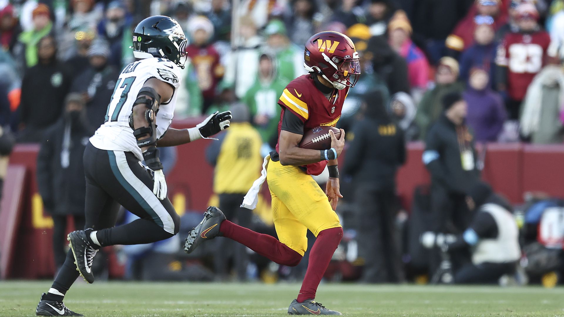 Washington QB Jayden Daniels runs past the Philadelphia Eagles during their Dec. 22 win.