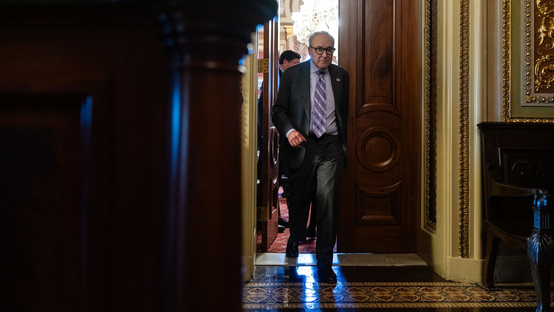 Chuck Schumer walks through the Capitol after a Democratic luncheon amid the ongoing government shutdown.
