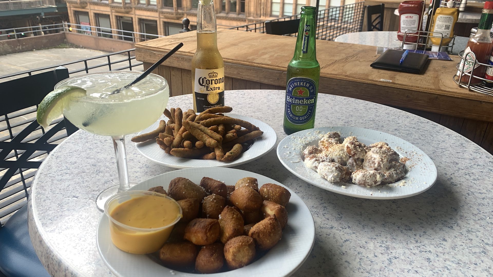 Photo of food and drinks on a bar table. 