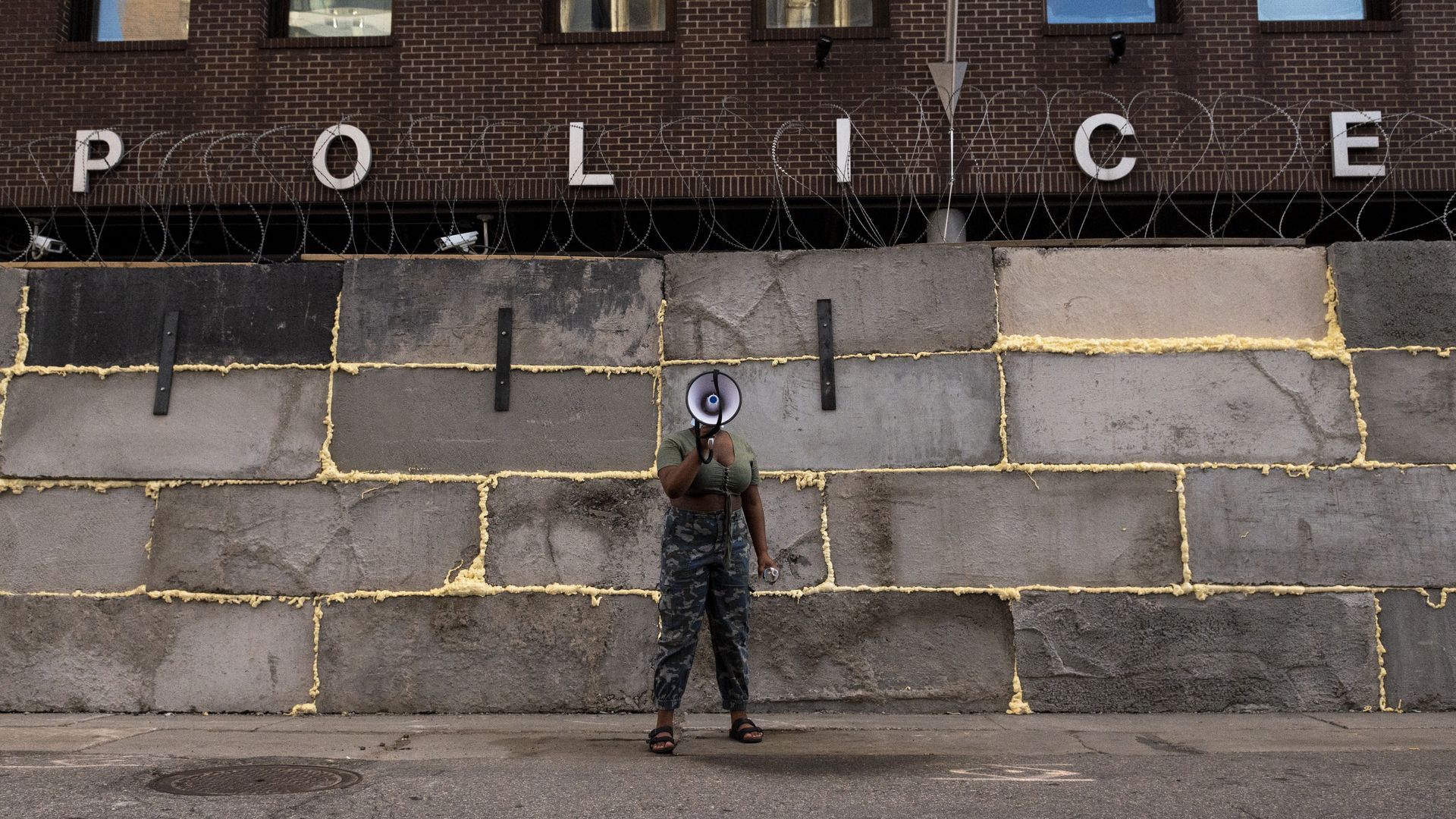 man in front of police station