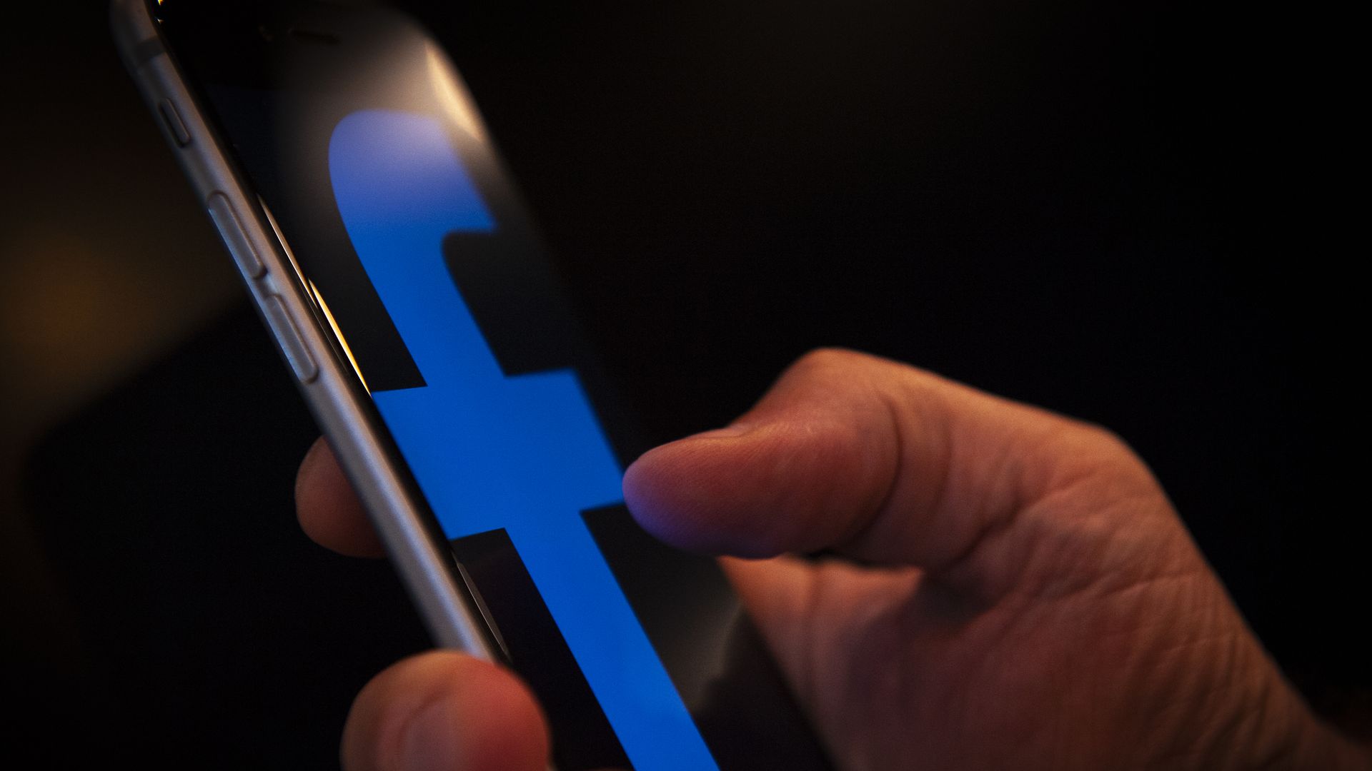 A Facebook logo is seen on an iPhone is seen in this photo illustration on July 9, 2018. (Photo by Jaap Arriens/NurPhoto via Getty Images)
