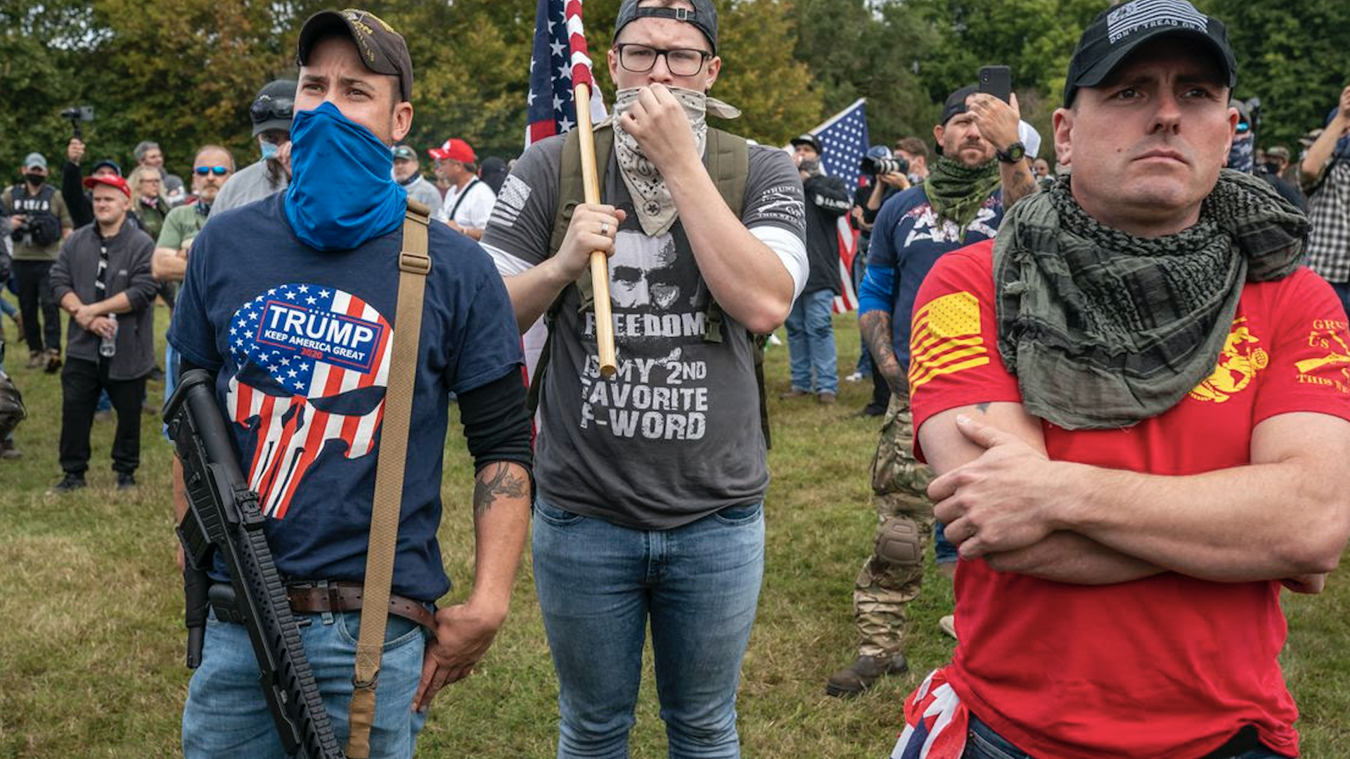 Armed attendees listen to speakers during a Proud Boy rally 