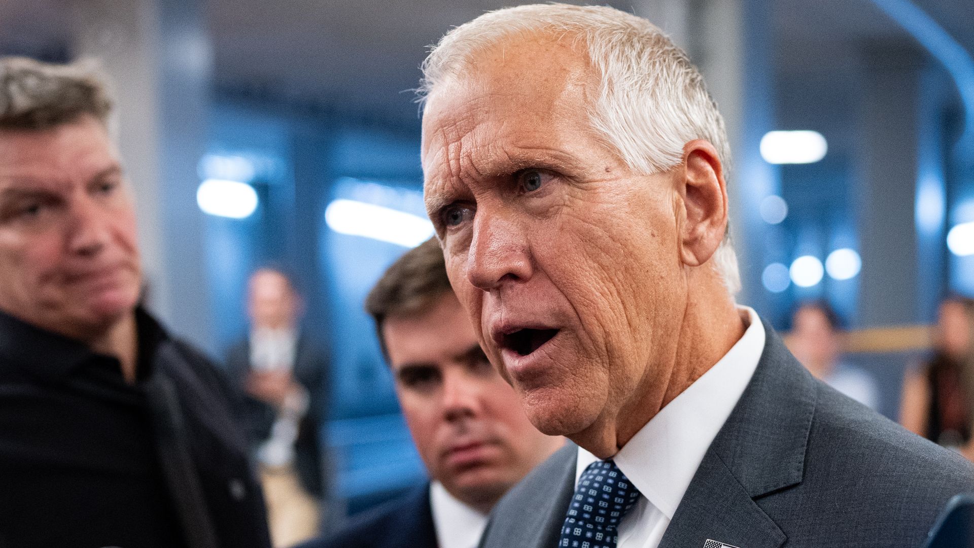 Sen. Thom Tillis speaks with reporters in the Senate subway at the U.S. Capitol.