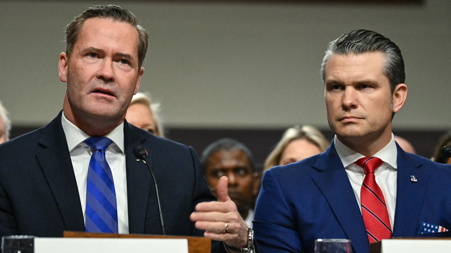 Donald Trump's nominee for Defense Secretary, looks on as he is introduced by incoming National Security Advisor Michael Waltz (L) during his confirmation hearing before the Senate Armed Services Committee on Capitol Hill on January 14