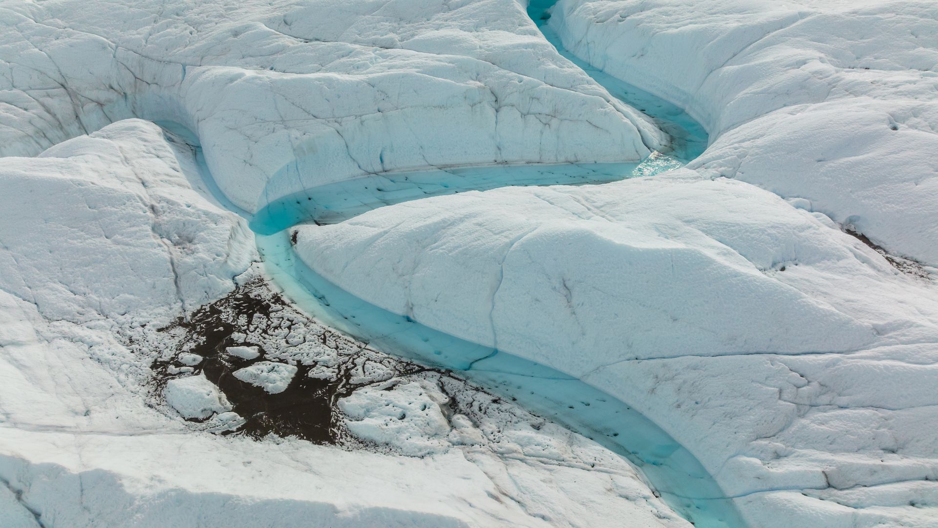 Meltwater coursing through the Greenland Ice Sheet in August 2022.