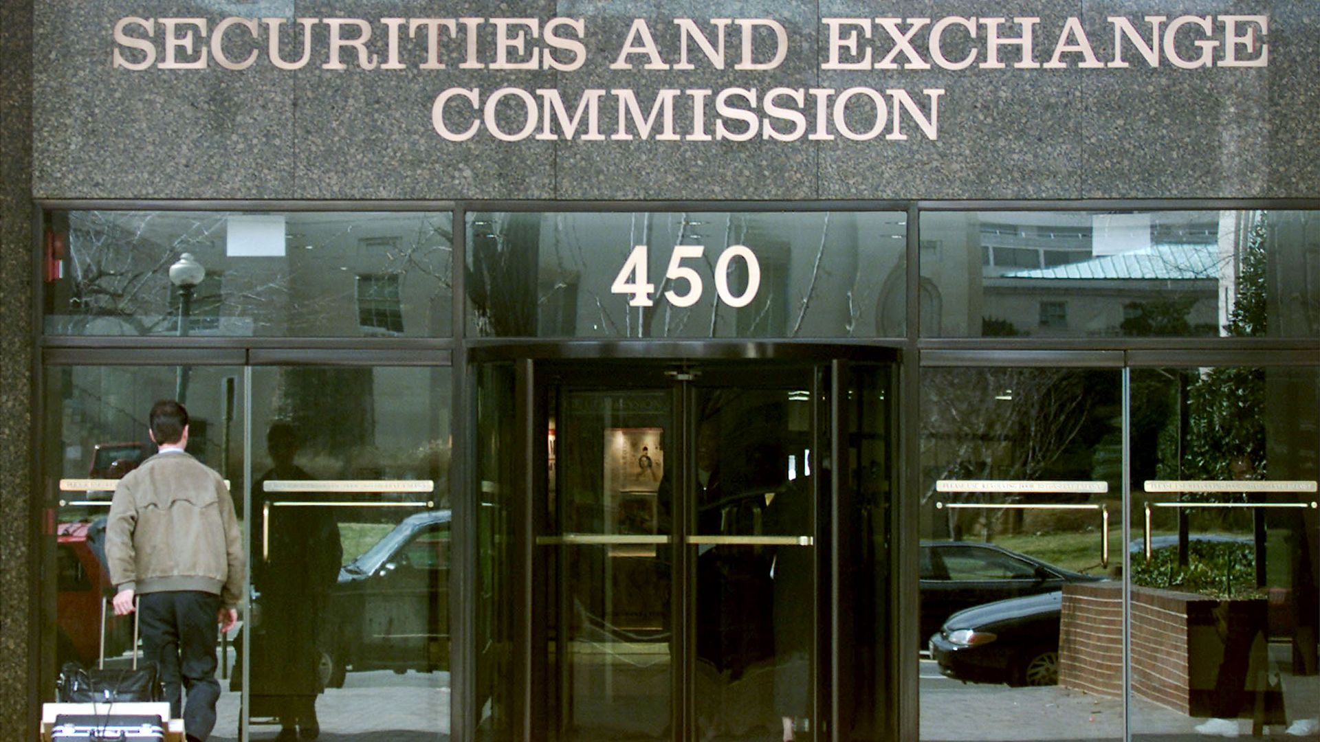 A man enters the U.S. Securities and Exchange Commission building March 9, 2001 in Washington, DC.