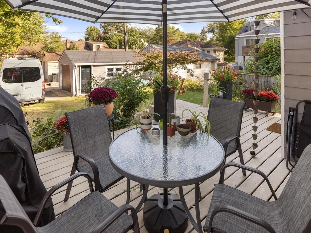 Patio table and chairs on a back deck.