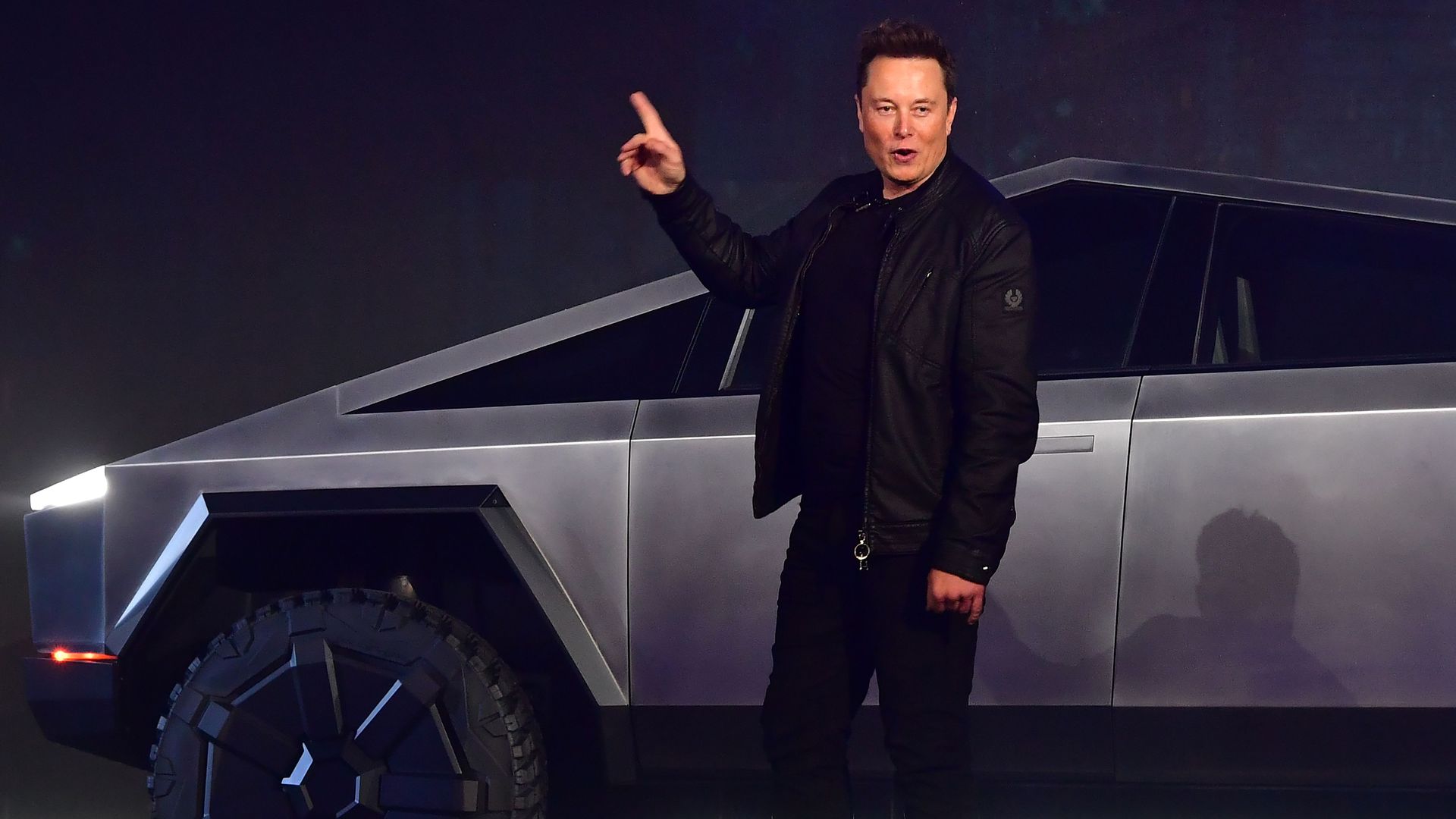 Tesla co-founder and CEO Elon Musk gestures while introducing the newly unveiled all-electric battery-powered Tesla Cybertruck 