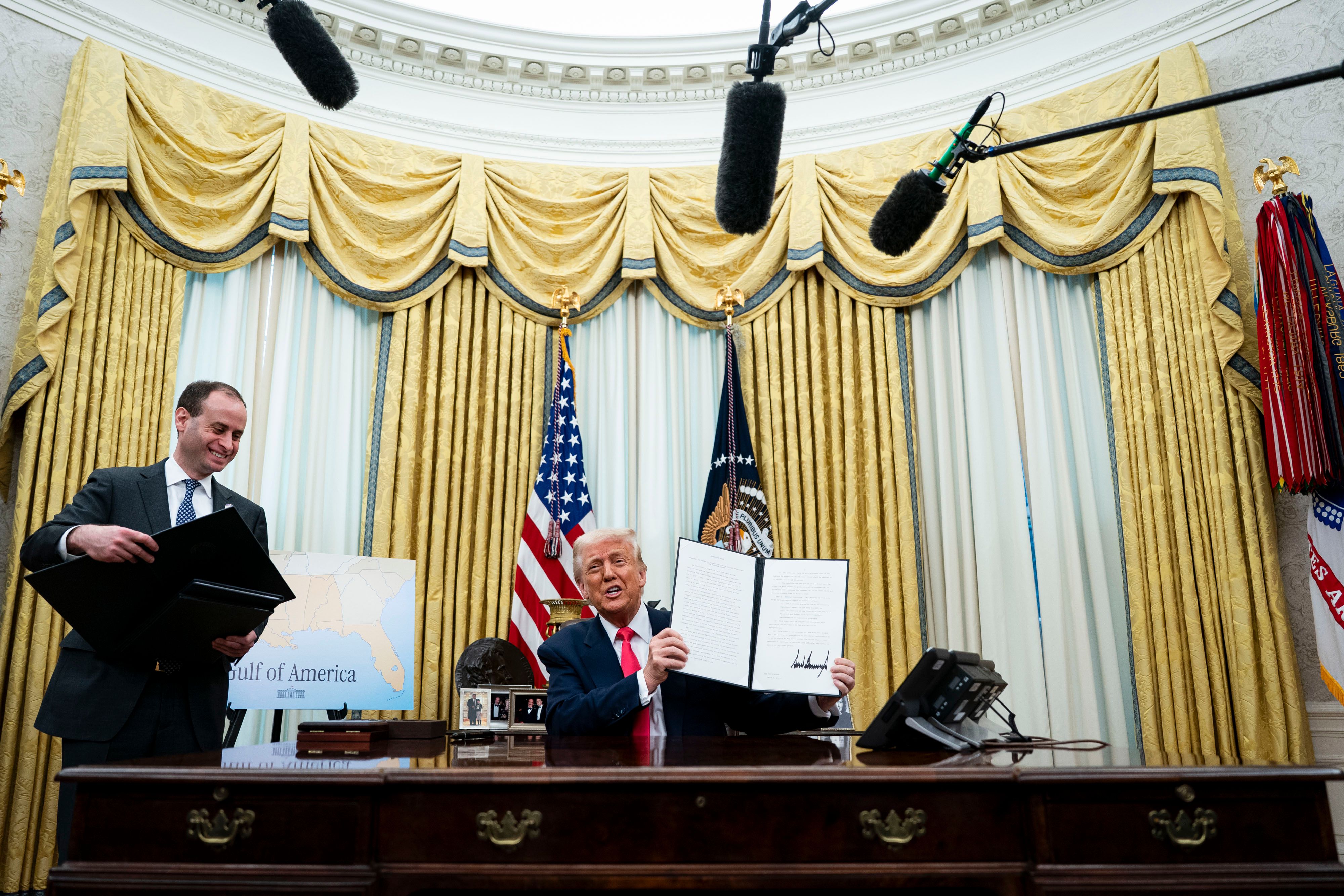 Will Scharf tees up executive orders for President Trump in the Oval Office last year.