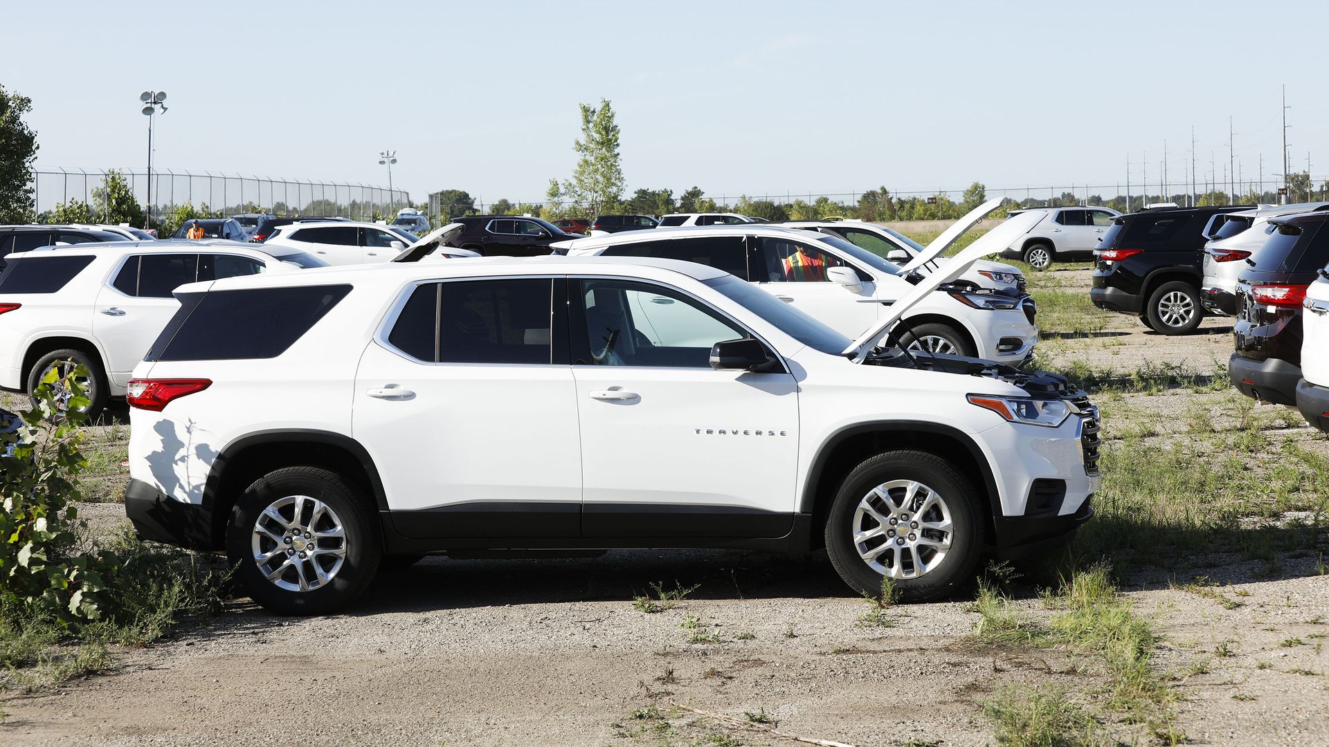 General Motors vehicles sit in a holding lot September 2, 2021 in Lansing, Michigan. 