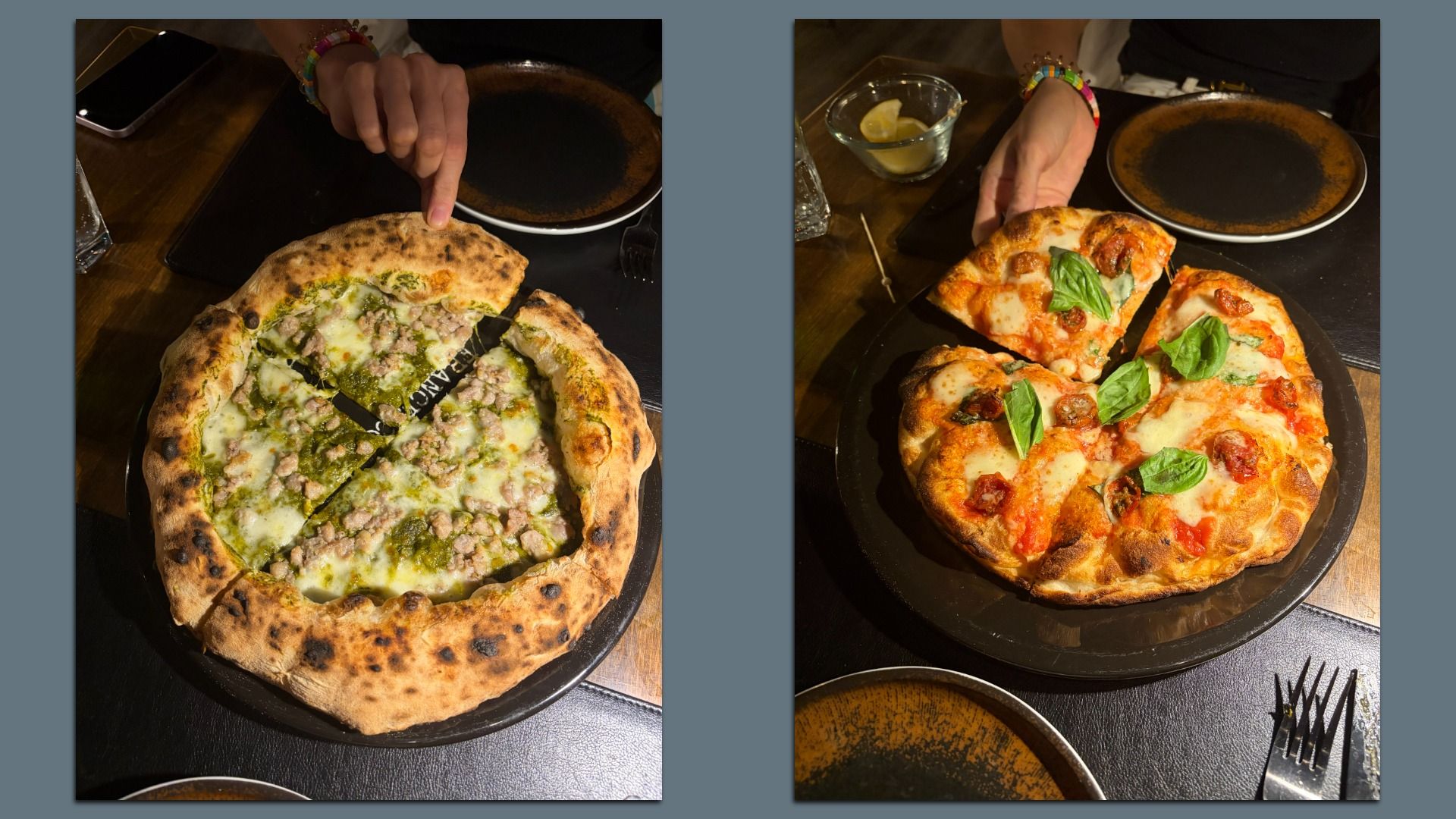 Two pizzas on dark plates at a wooden table. Left: white sauce with greens and chunks of meat; right: tomato sauce, mozzarella, fresh basil.
