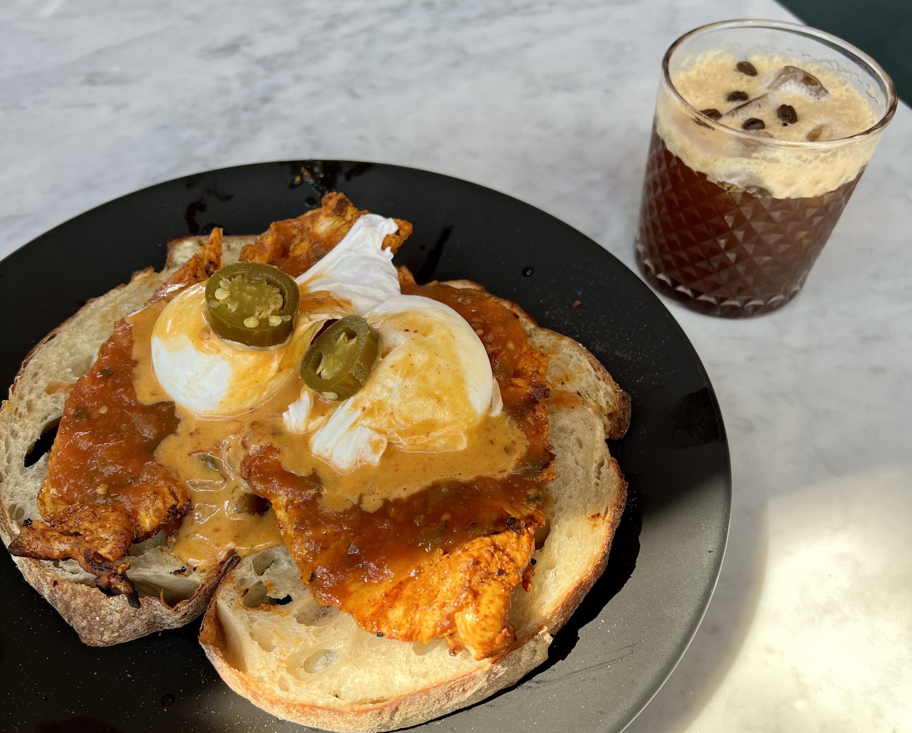 A plate of bread and eggs in the sunlight.